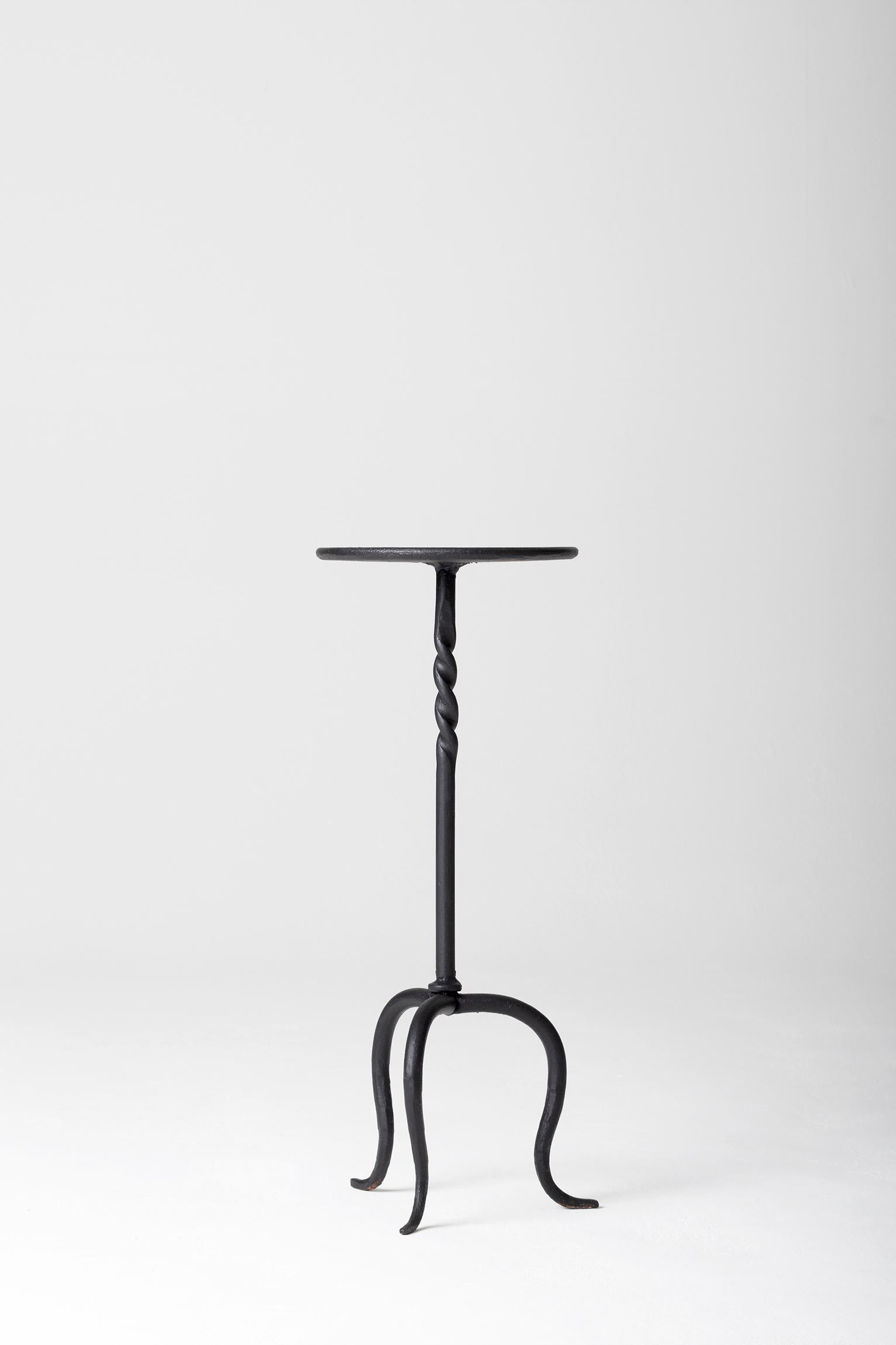 A black patinated wrought iron martini table
Spain, second half of the 20th century.