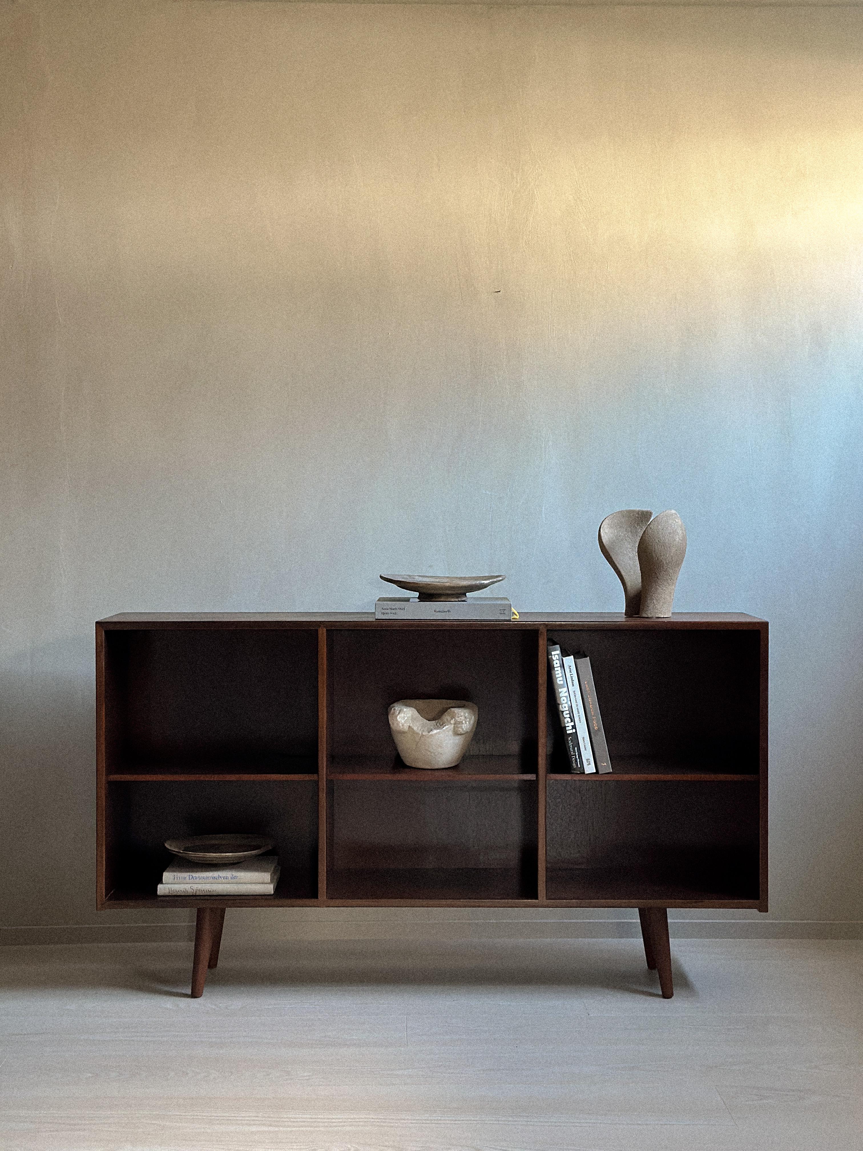 A beautiful bookshelf in rosewood veneer from Denmark, c. 1970s. 

Wear consistent with age and use. 