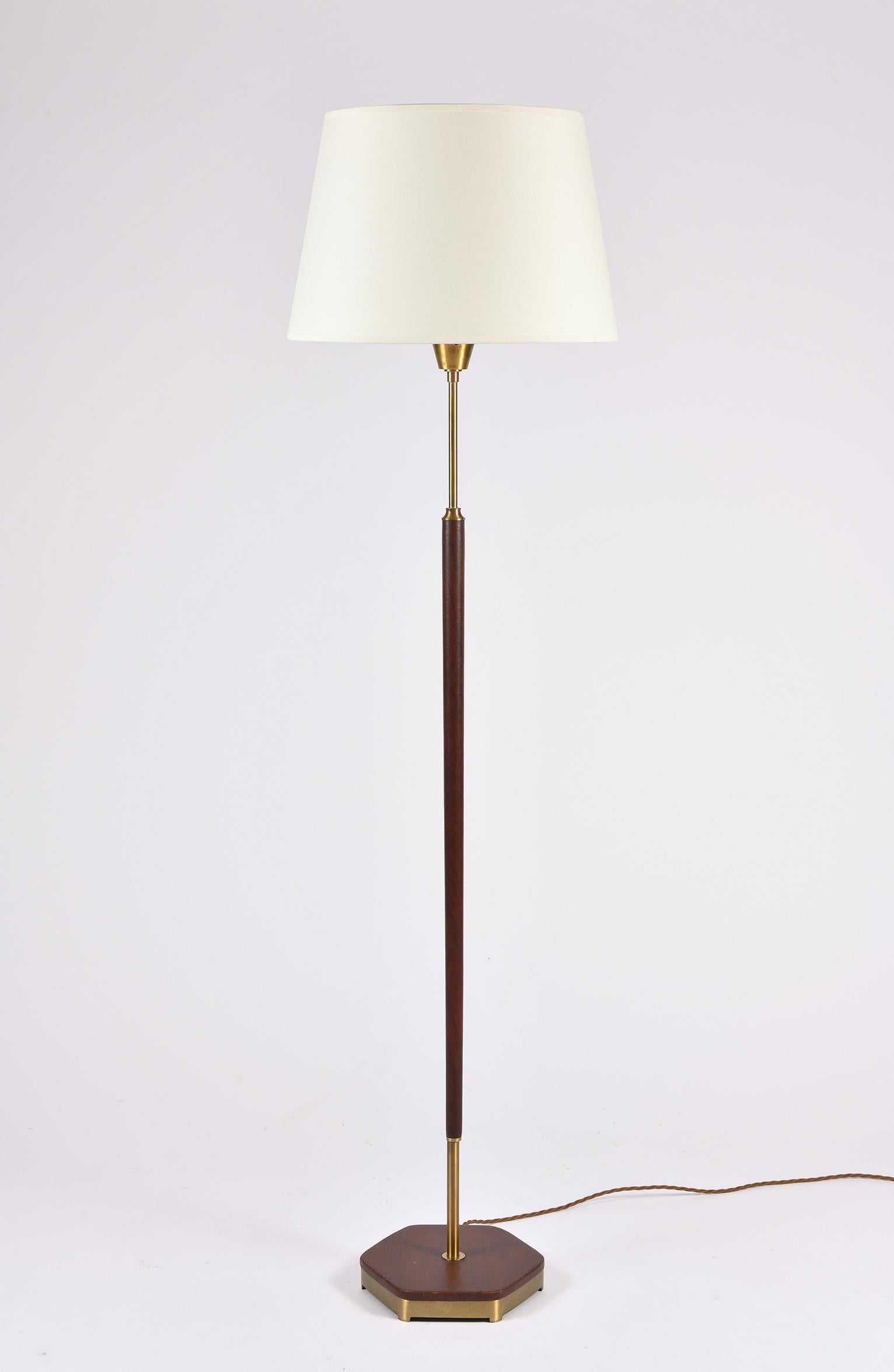 A brass and brown leather floor lamp
Sweden, circa 1950.