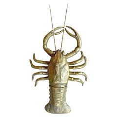 A mid century brass sculptured lobster with removable top storage compartment