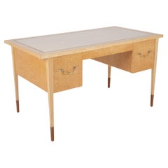 A Mid-Century Burled Maple Desk by Tommi Parzinger