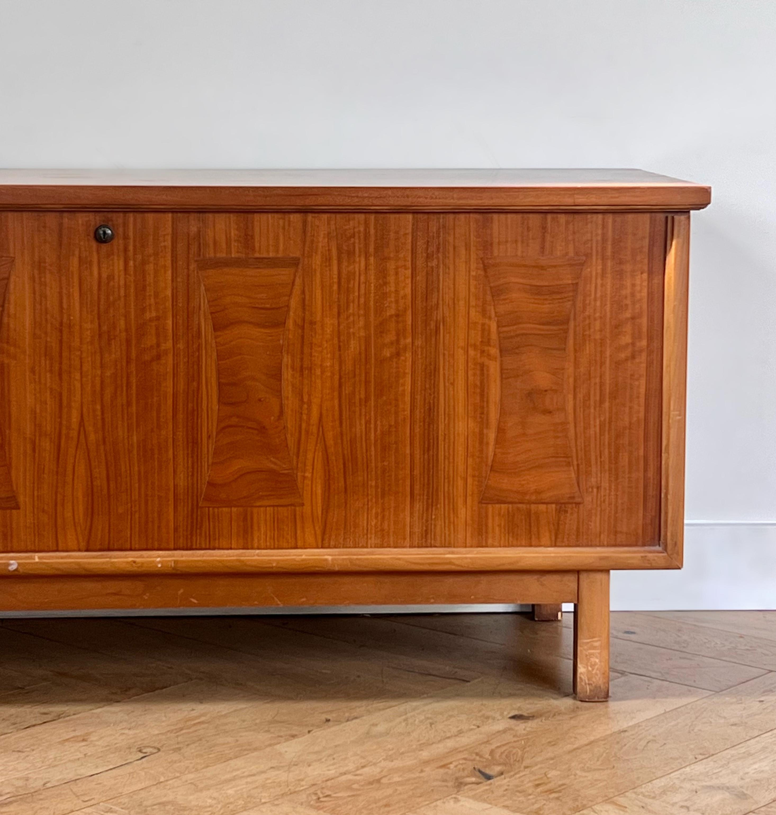 A mid century modern cedar wood blanket chest by Lane Furniture, circa 1960. Hand-crafted in Altavista, Virginia, this piece features a rich wood grain, similar to burl, and ever-so-slightly embossed panels on the front façade, as can be seen in