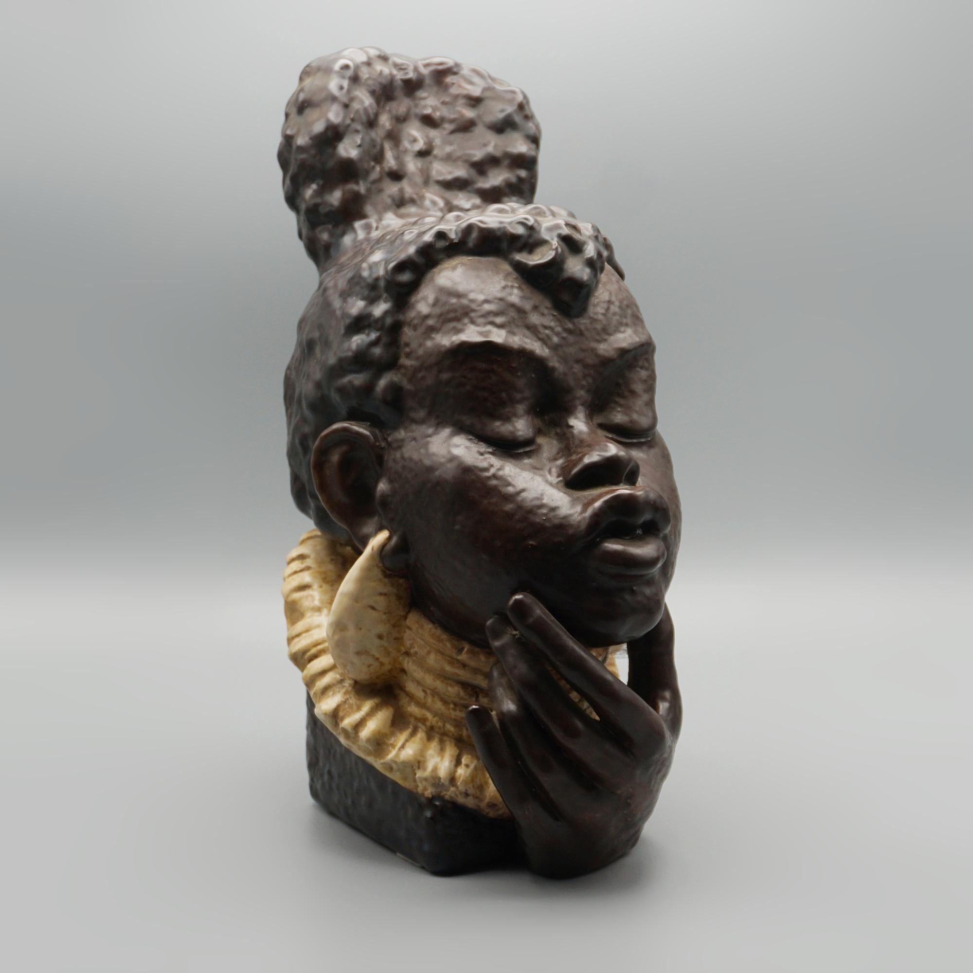 A stylised mid-century ceramic bust of a woman by Ove Rasmussen for Bornholm. Marks to underneath. 

Dimensions: H 31cm W 12cm D 18cm

Origin: Danish

Date: Circa 1950

Item Number: 2905254