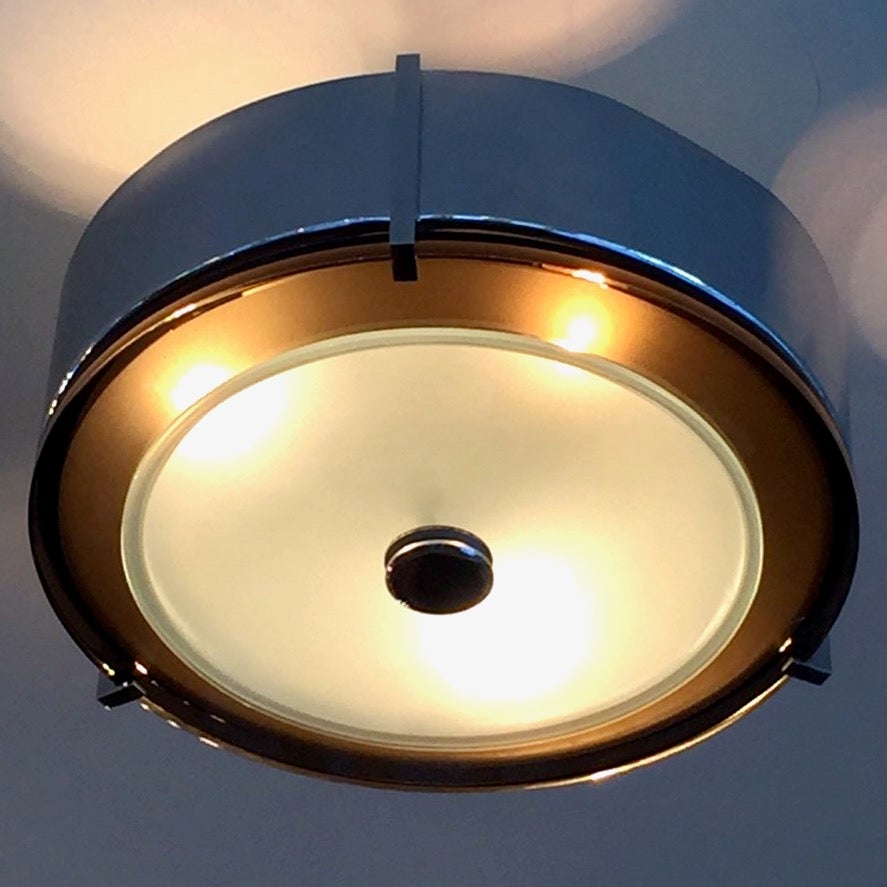 A good quality mid-century chrome and glass Modernist Italian ceiling flush mount light , plafonniere, possibly Fontana Arte. 
2 layers of glass including a thick dark glass ring and a light glass circle. 