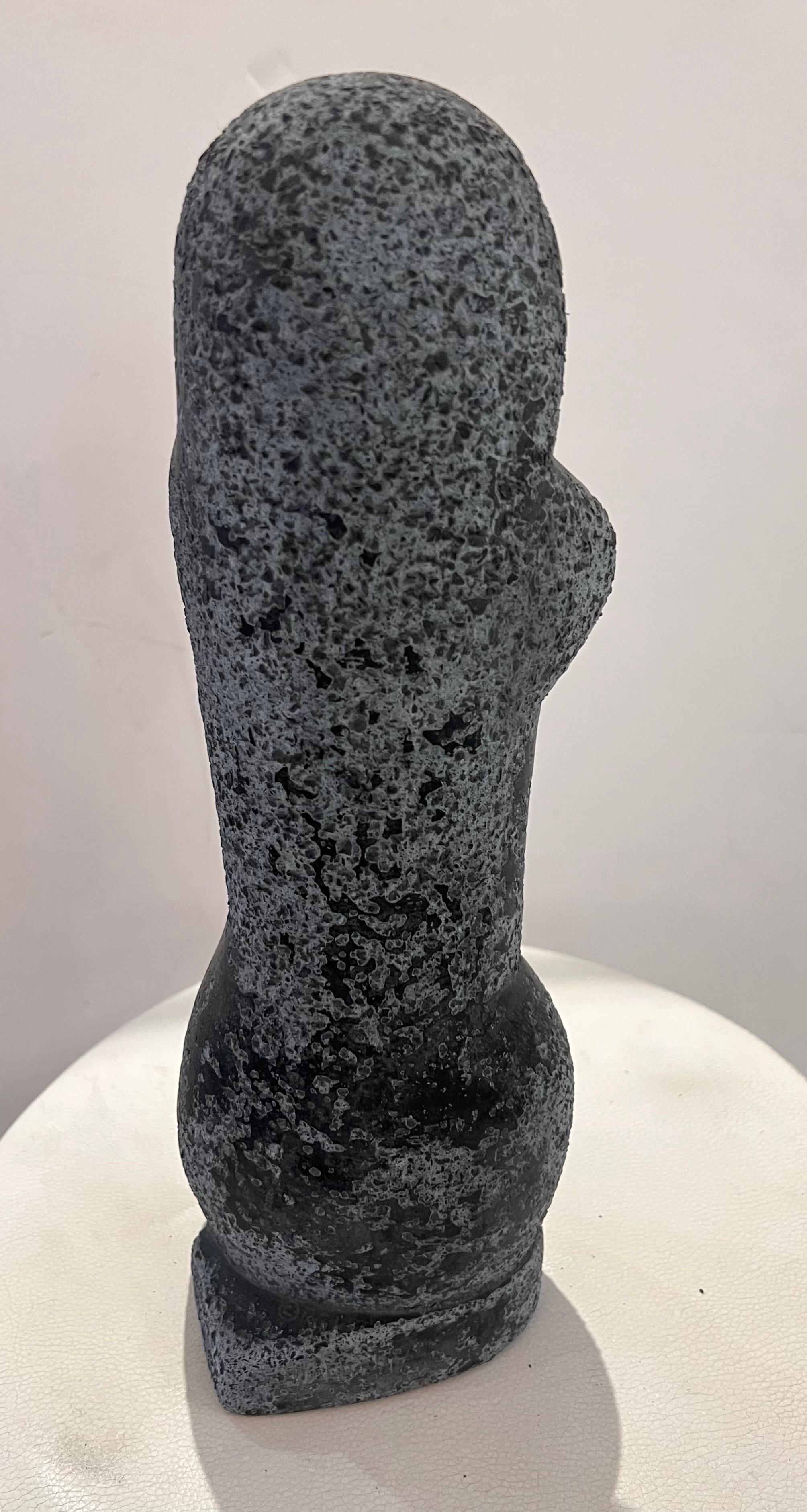 A cubist style cast stone sculpture by Oronzio Maldarelli. The female figure signed on base with grey cast store with a black chalky finished surface. 14 inches tall.