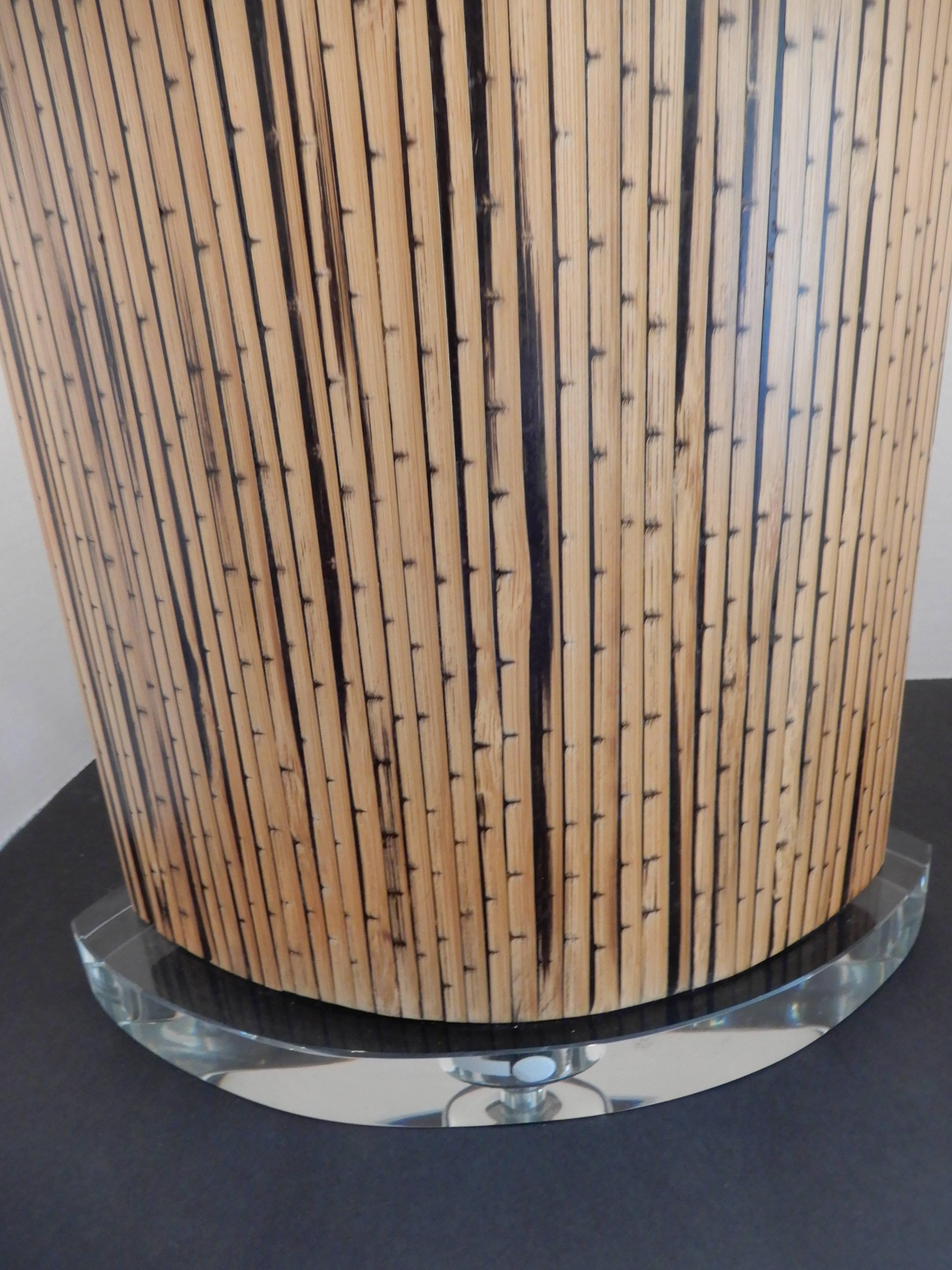 Mid-Century Danish Modern bamboo and Lucite table lamp, with a Lucite base and top and matching original finial.
New oval shade, three way switch excellent condition.