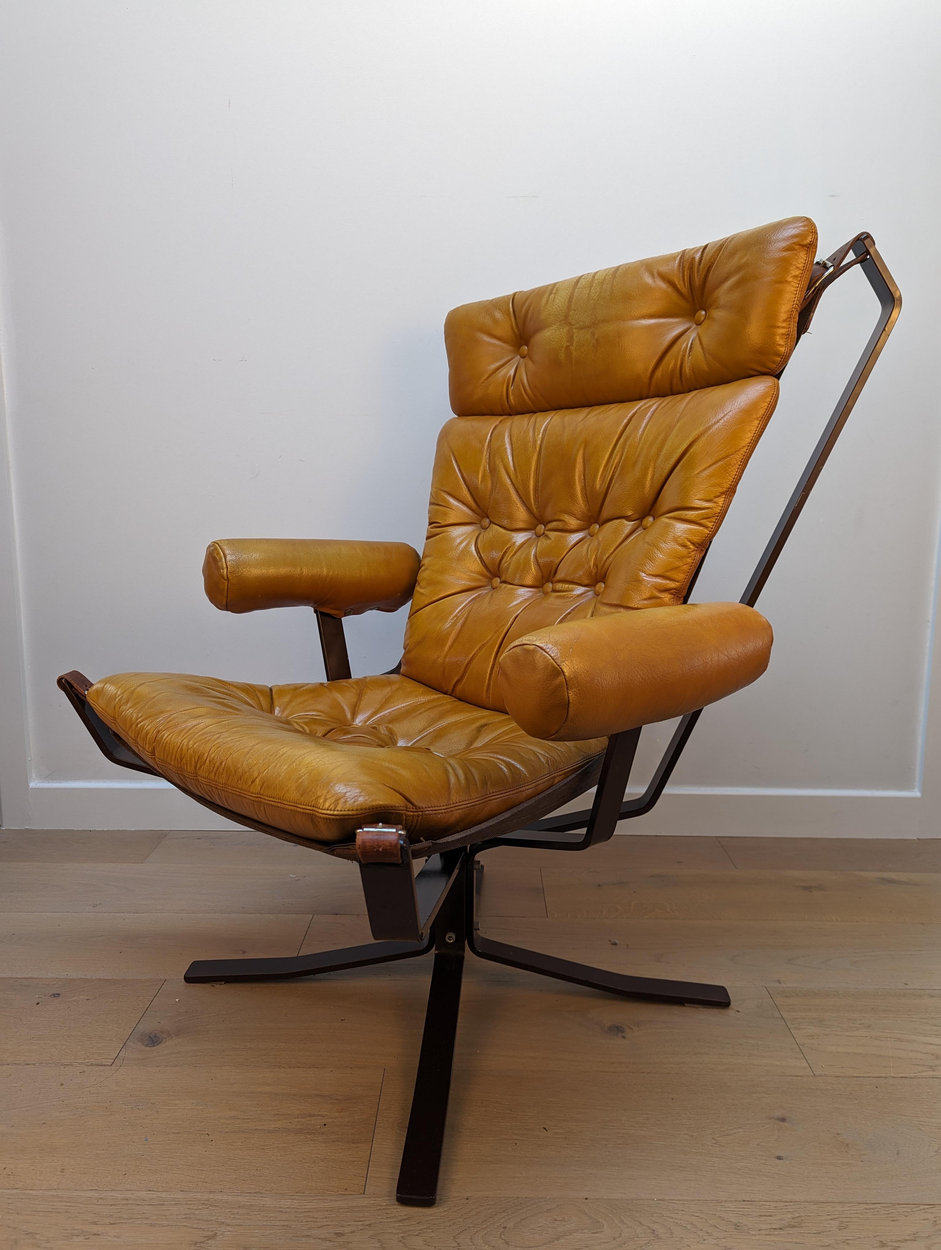 A rare ‘Superstar’ lounge set by Mid Century Danish furniture producer Trygg Mobler that was only produced in limited numbers between 1973-76.

This features tan leather upholstery, that nestled into a canvas sling support that is suspended between