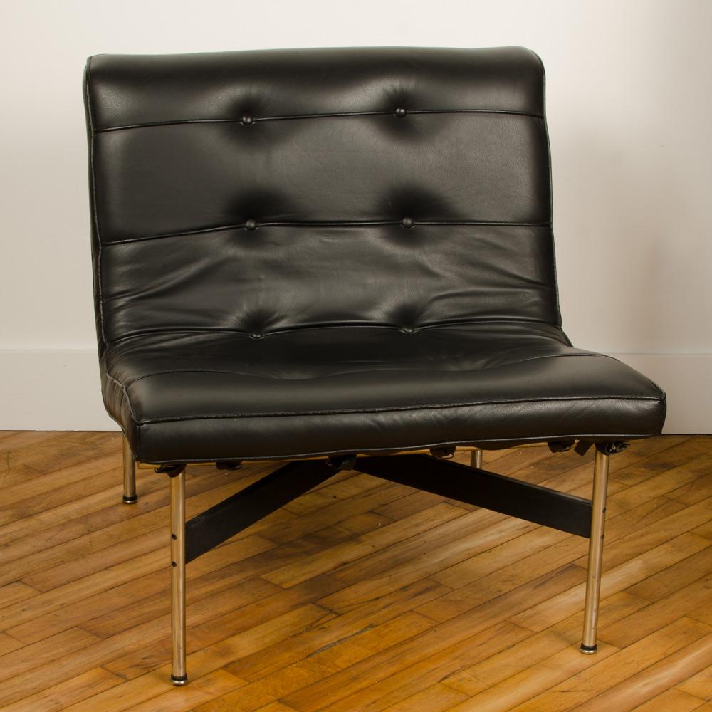 A mid-century designed black leather lounge chair with chrome base, 1952 designed by William Katavalos, Ross Littell, and Douglas Kelly.
 