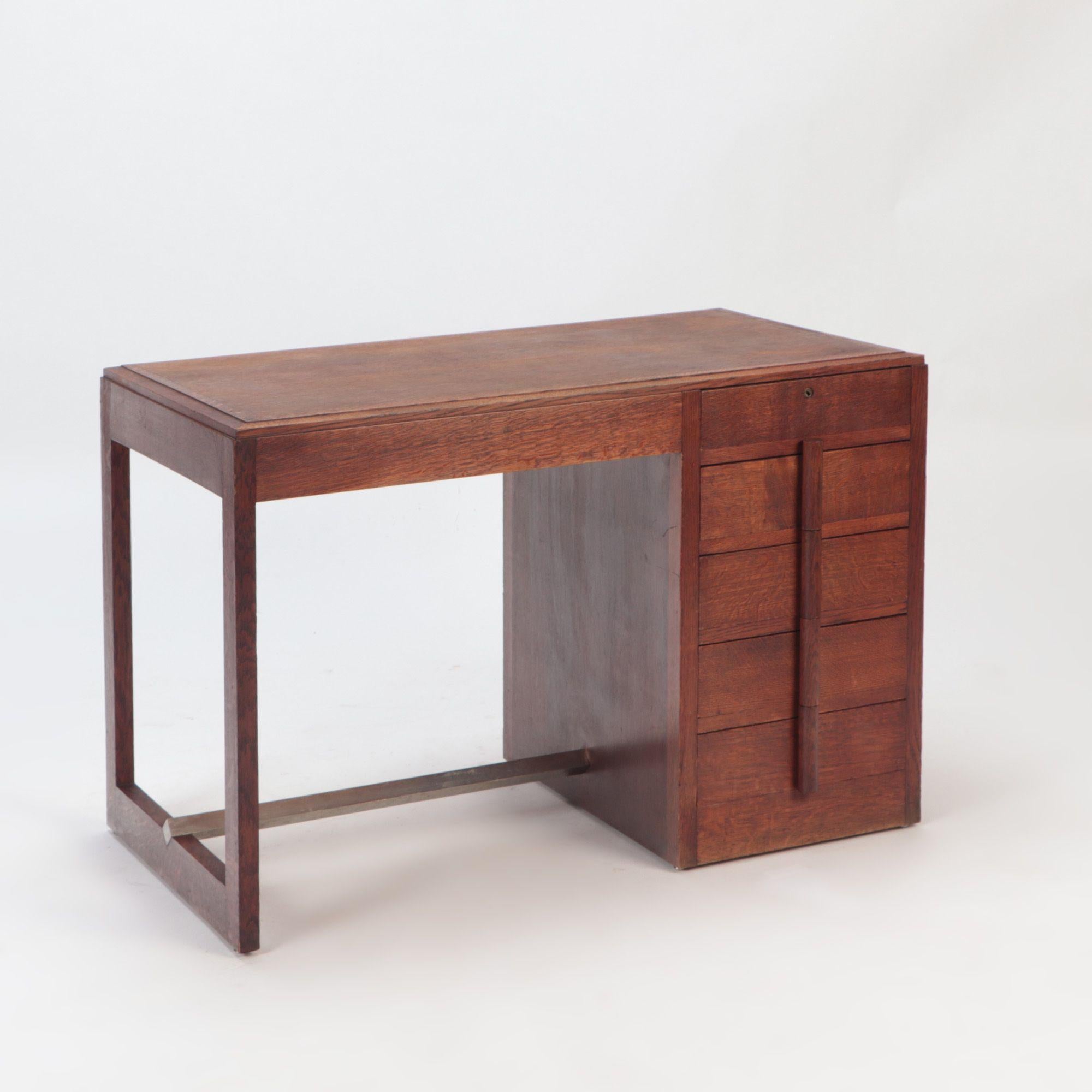 Mid-Century Modern A Mid Century French oak desk in the manner of Charles Dudouyt, circa 1940. For Sale