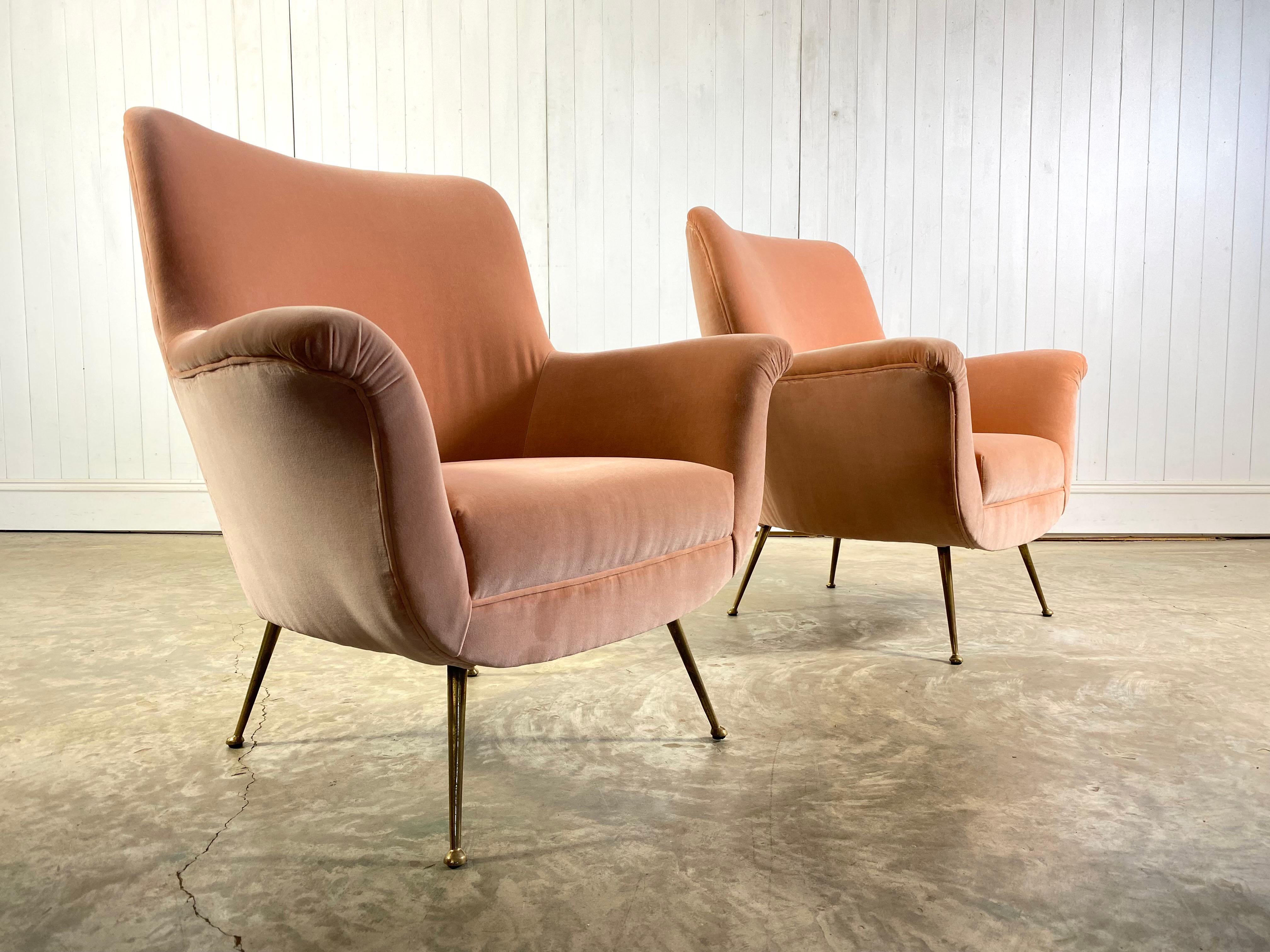 This stunning rose-pink-blush midcentury armchair was sourced in Italy, circa 1950s.

This has been fully re-upholstered in this fantastic colour and the legs are original in brass with some patina.

A classic midcentury shape.