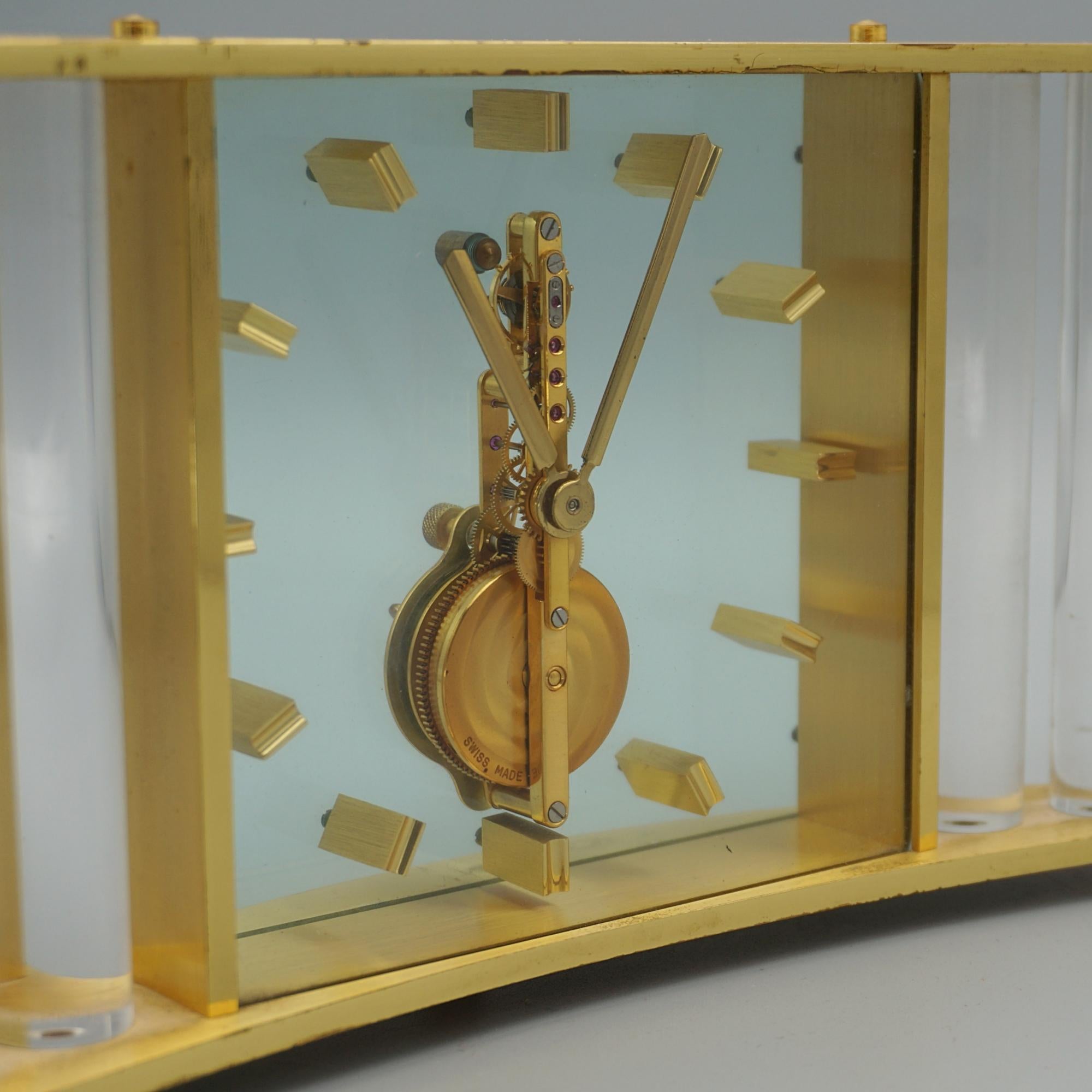 A Mid-Century mantle clock by Jaeger LeCoultre. Brass case with original glass rods and stylised roman numerals. Original 8 day movement, in full working order.

H 11cm W 25cm D 4cm

Origin: Swiss

Date: Circa 1960

Founded in 1833 by Antoine