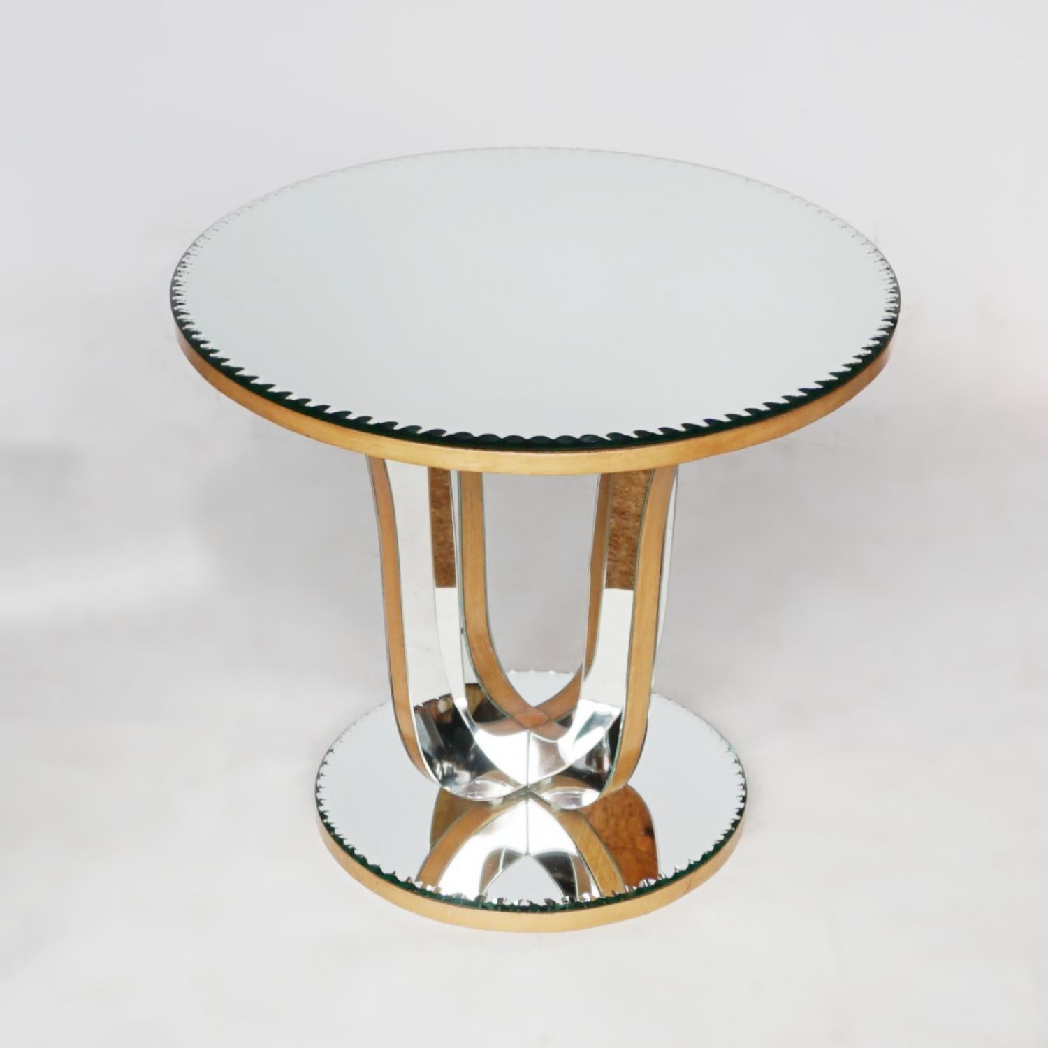 A Mid-Century mirrored glass side table. Bevelled trim around the base and the table top. 

Dimensions: H 51cm, W 59cm, D 59cm 

Origin: English

Date: Circa 1950

Item number: 2405212

All of our furniture is extensively polished and