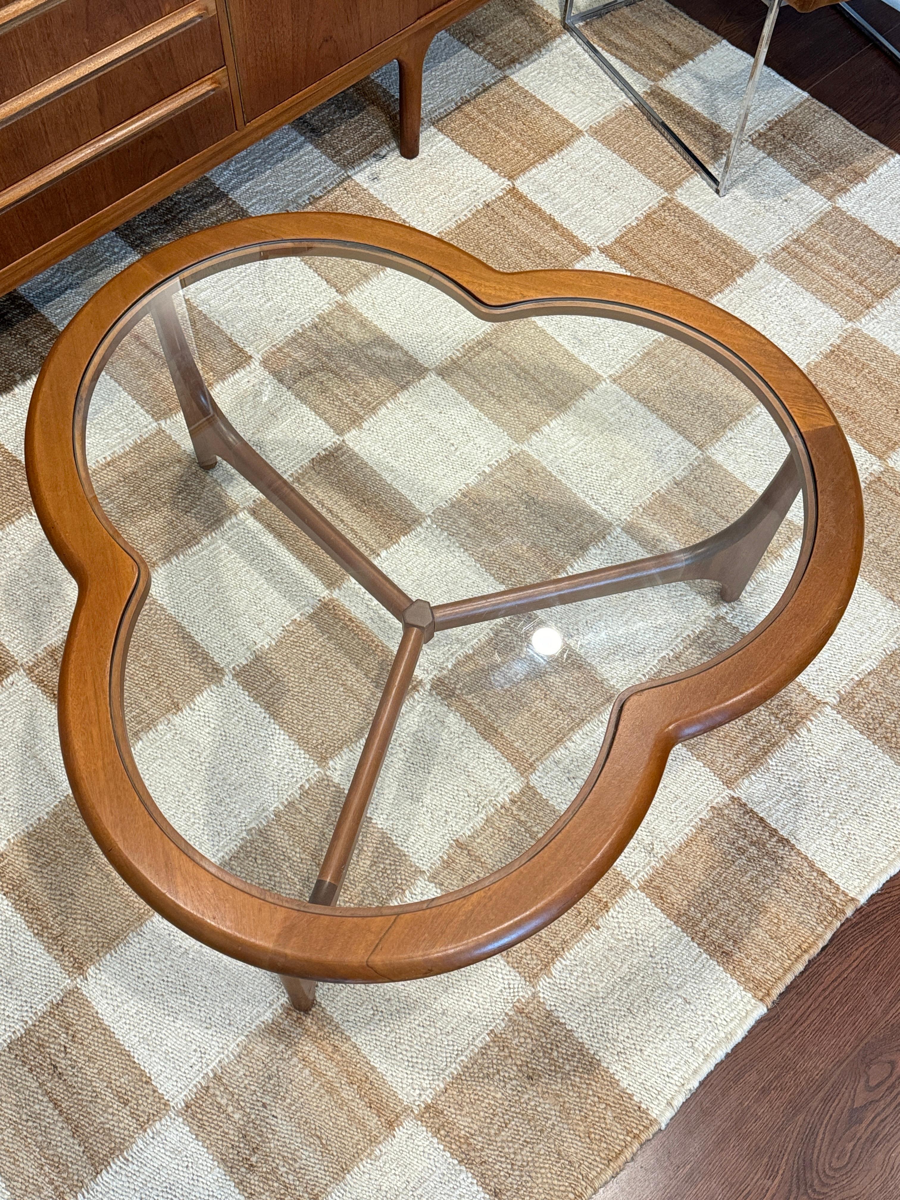 A mid century modern 3 leaf clover coffee table from the Stonehill Stateroom 6