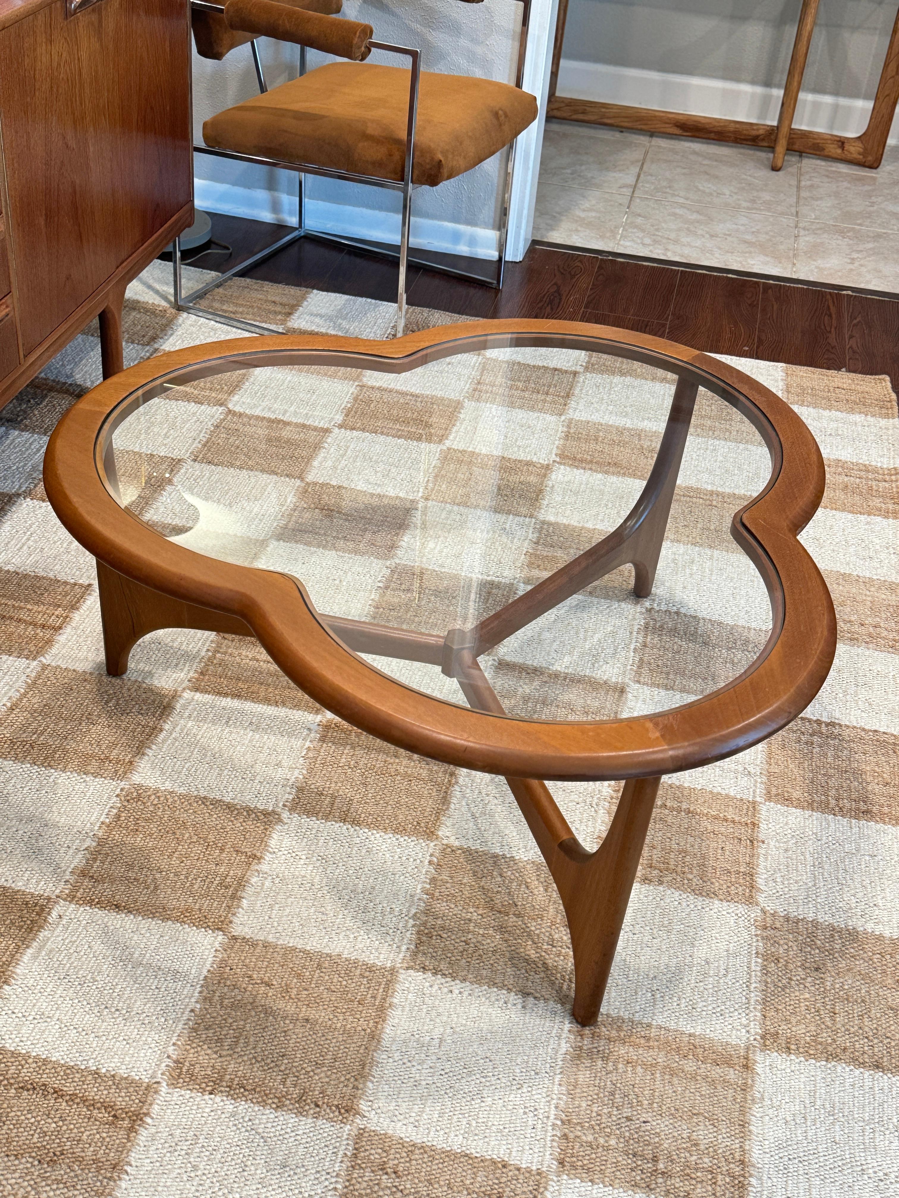 A mid century modern 3 leaf clover coffee table from the Stonehill Stateroom 7