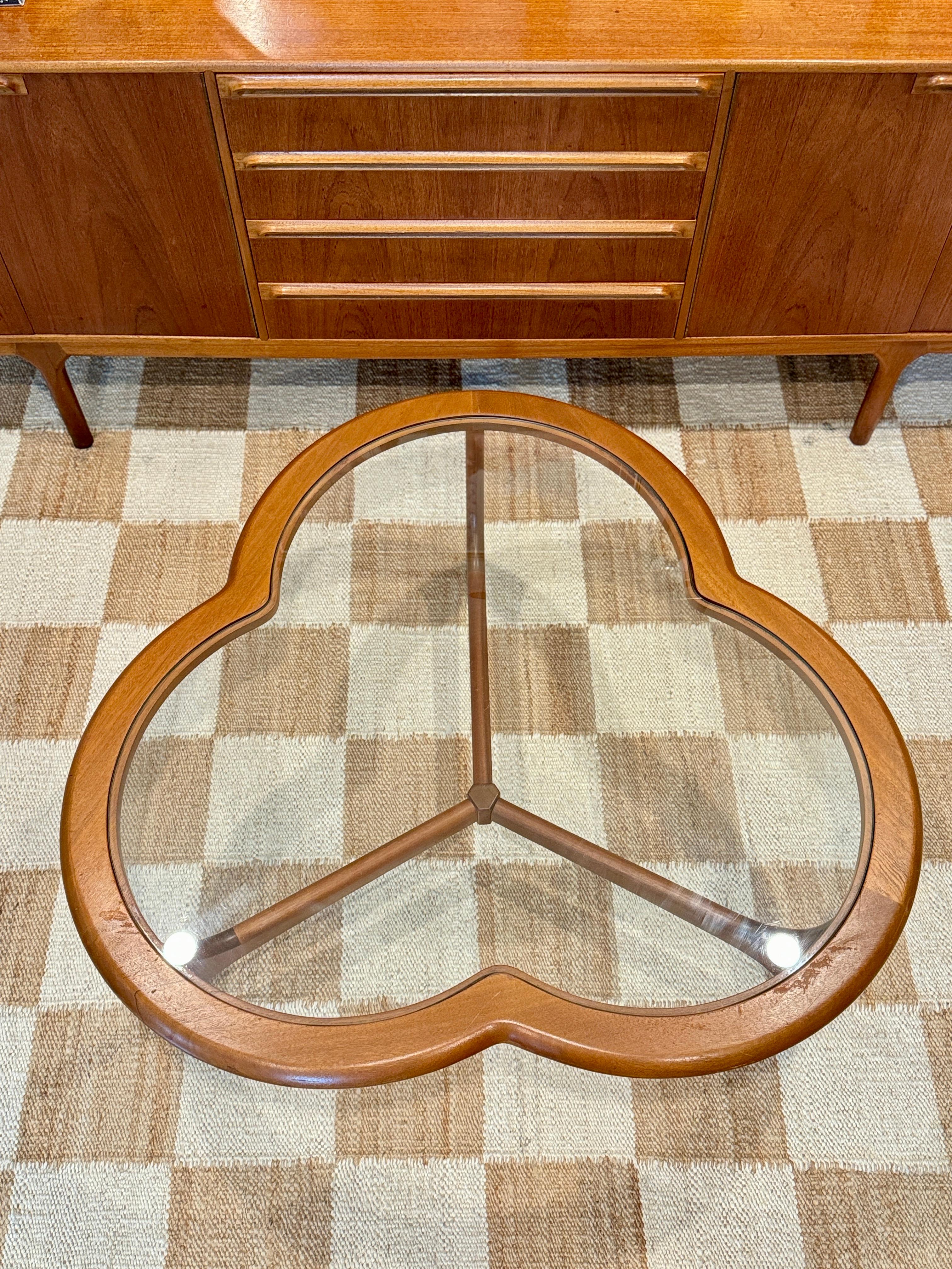 A mid century modern 3 leaf clover coffee table from the Stonehill Stateroom 1