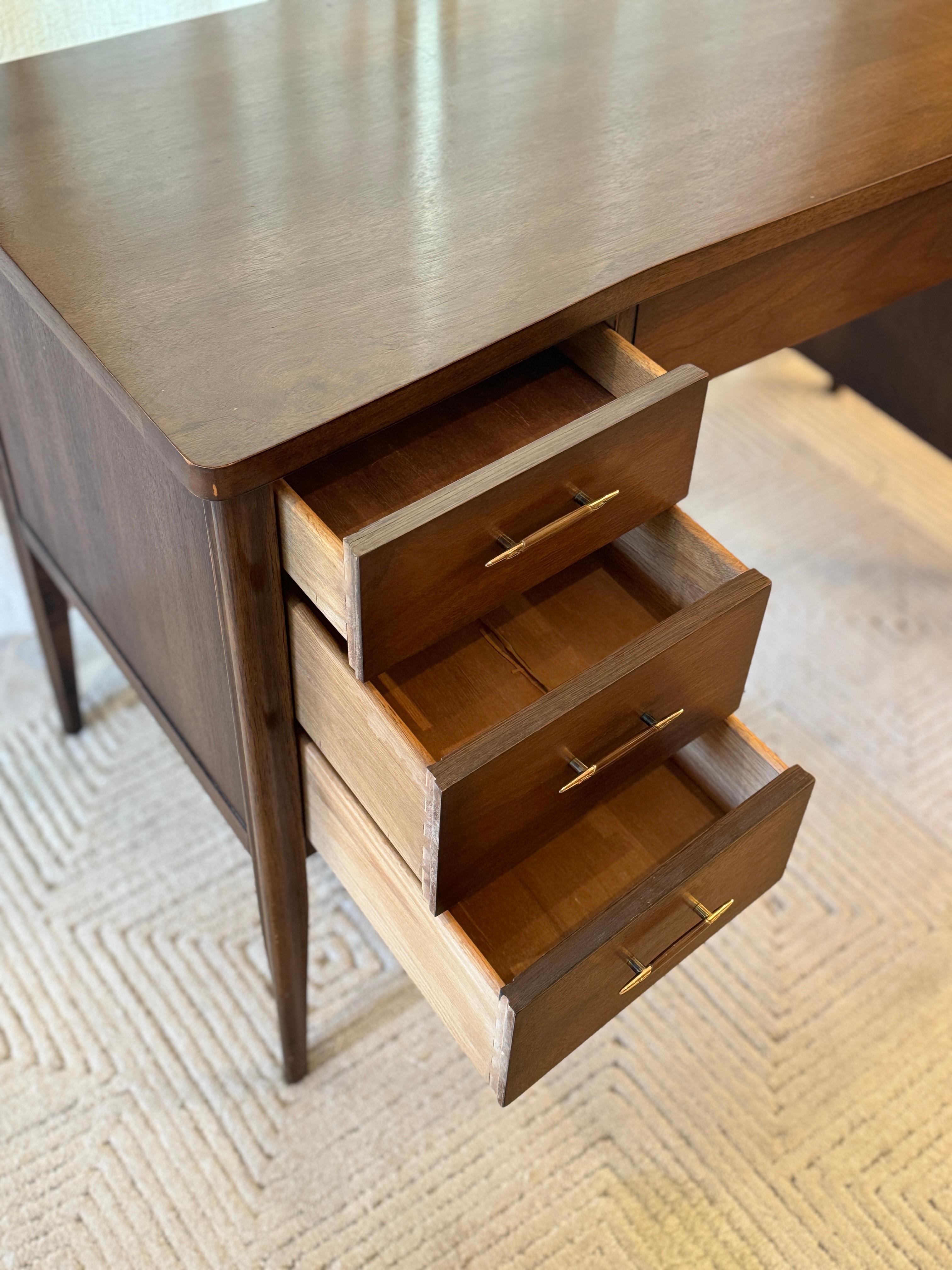 A mid century modern American icon, the Saga desk by Broyhill 1