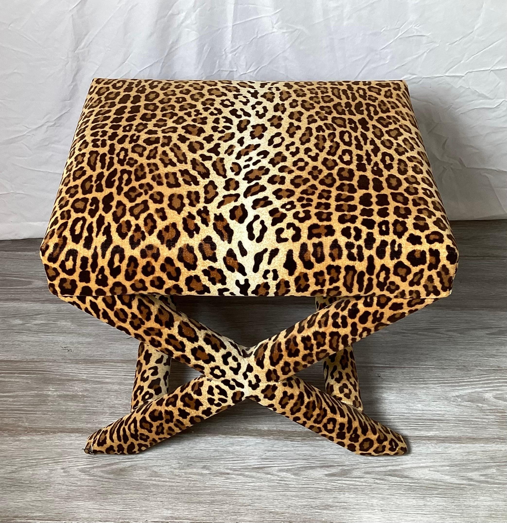 An iconic Billy Baldwin style X Bench recently recovered in a high quality dense leopard pattern velvet. This is a classic mid century piece.
