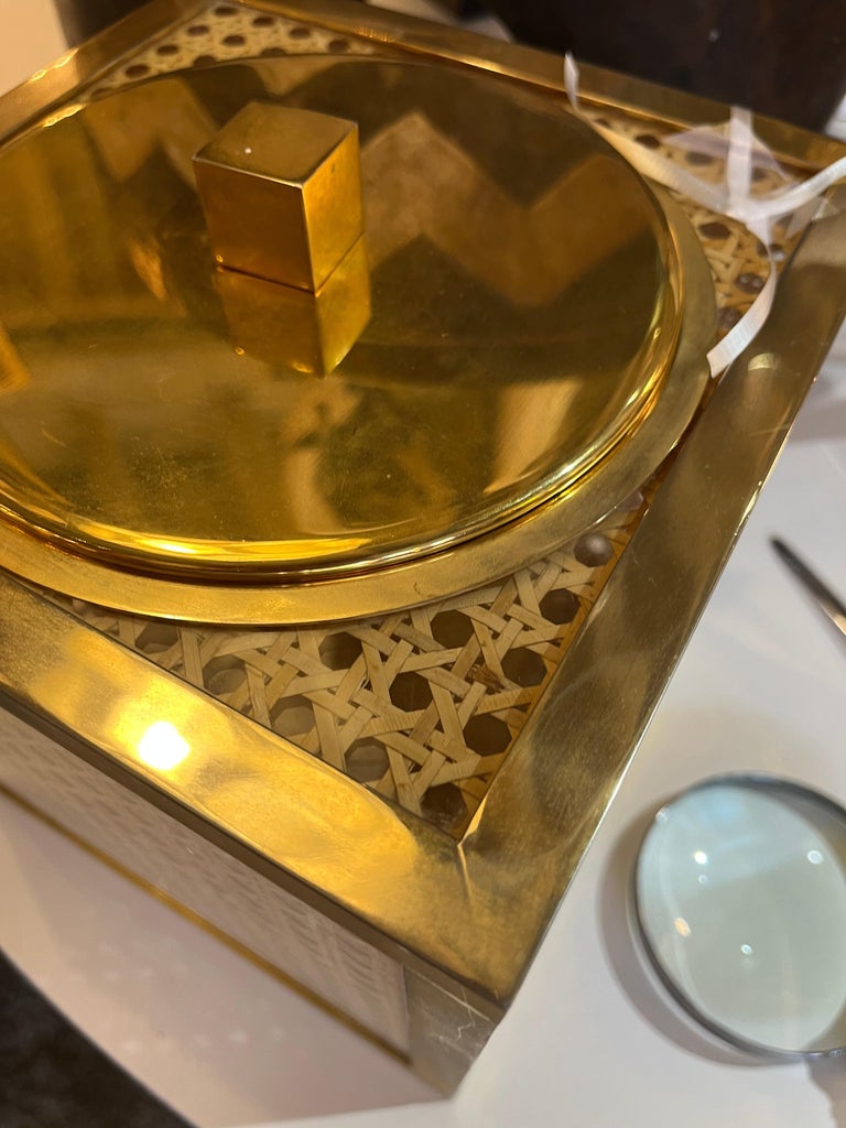 Attributed iconic Christian Dior design from the 1970s, this ice bucket's caning and Lucite is in excellent condition. Liner included. Would make a great fashion statement on your bar.