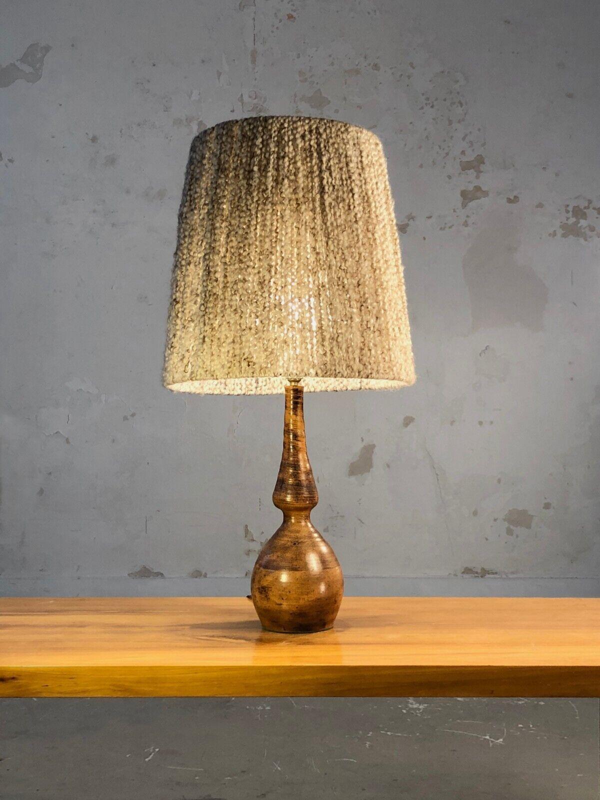 A spectacular and sensual table lamp, Post-Modernist, Brutalist, Popular Art, Shabby-Chic, Rustic Modern, with a Free-Form body in thick orange enameled ceramic with graphic decorations reminiscent of the compositions of Jacques Blin, unsigned, to