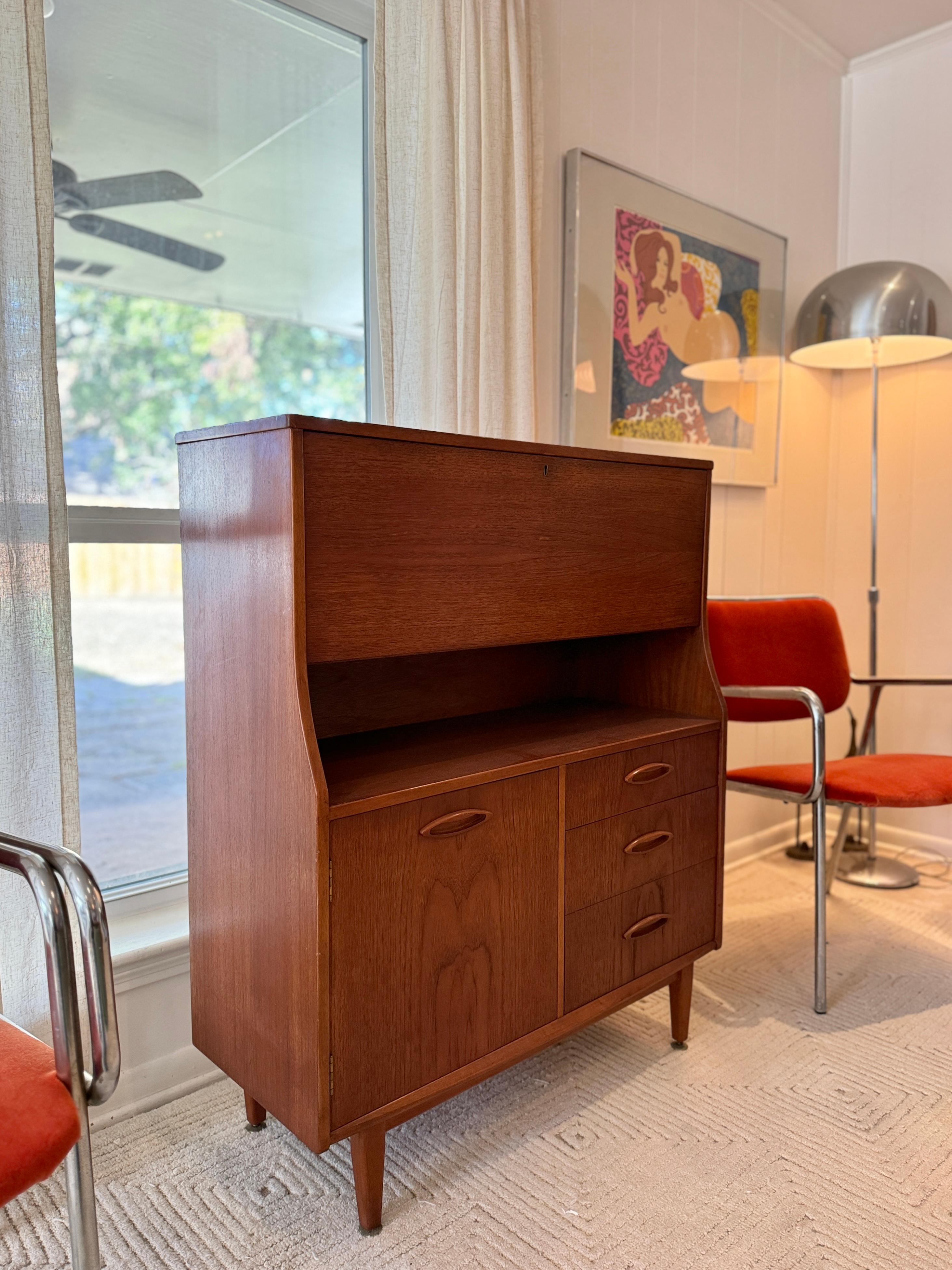 A mid century modern cabinet with a drop front desk by Jentique furniture 2