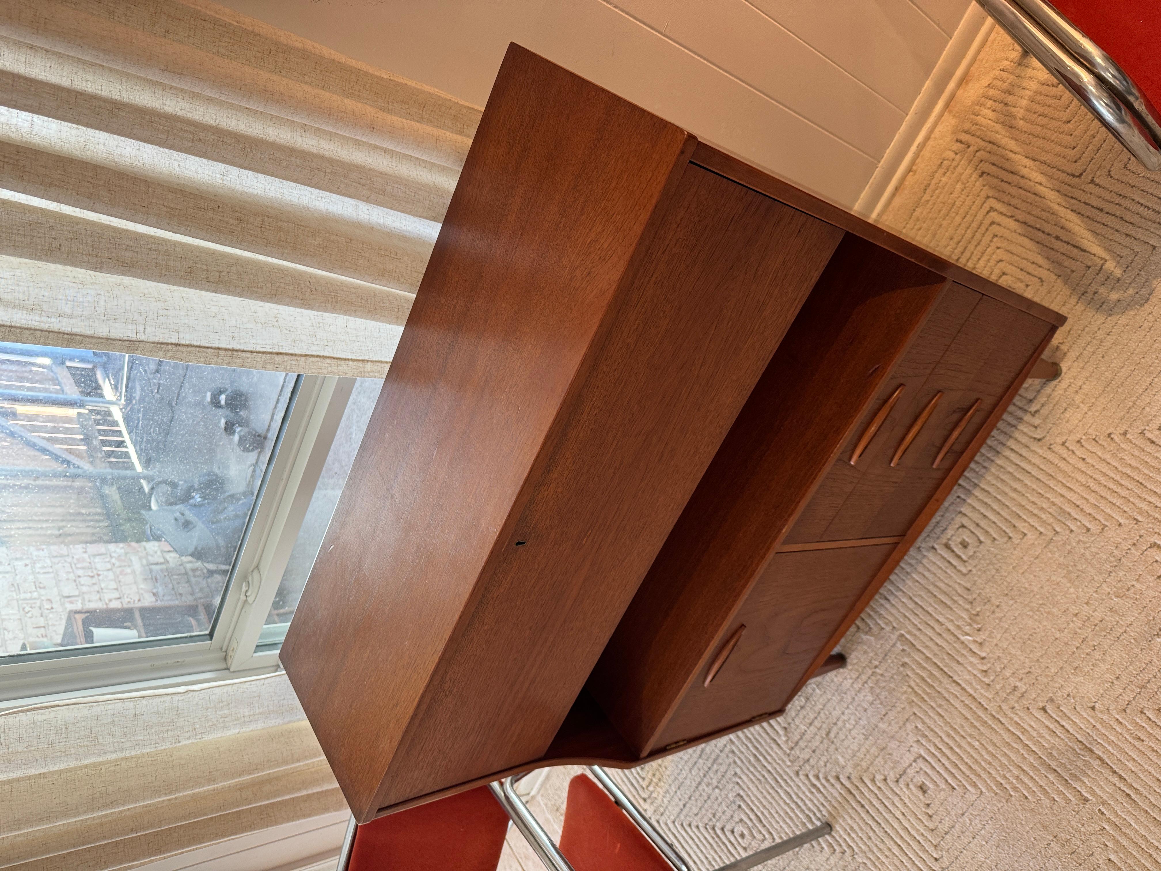A mid century modern cabinet with a drop front desk by Jentique furniture 3