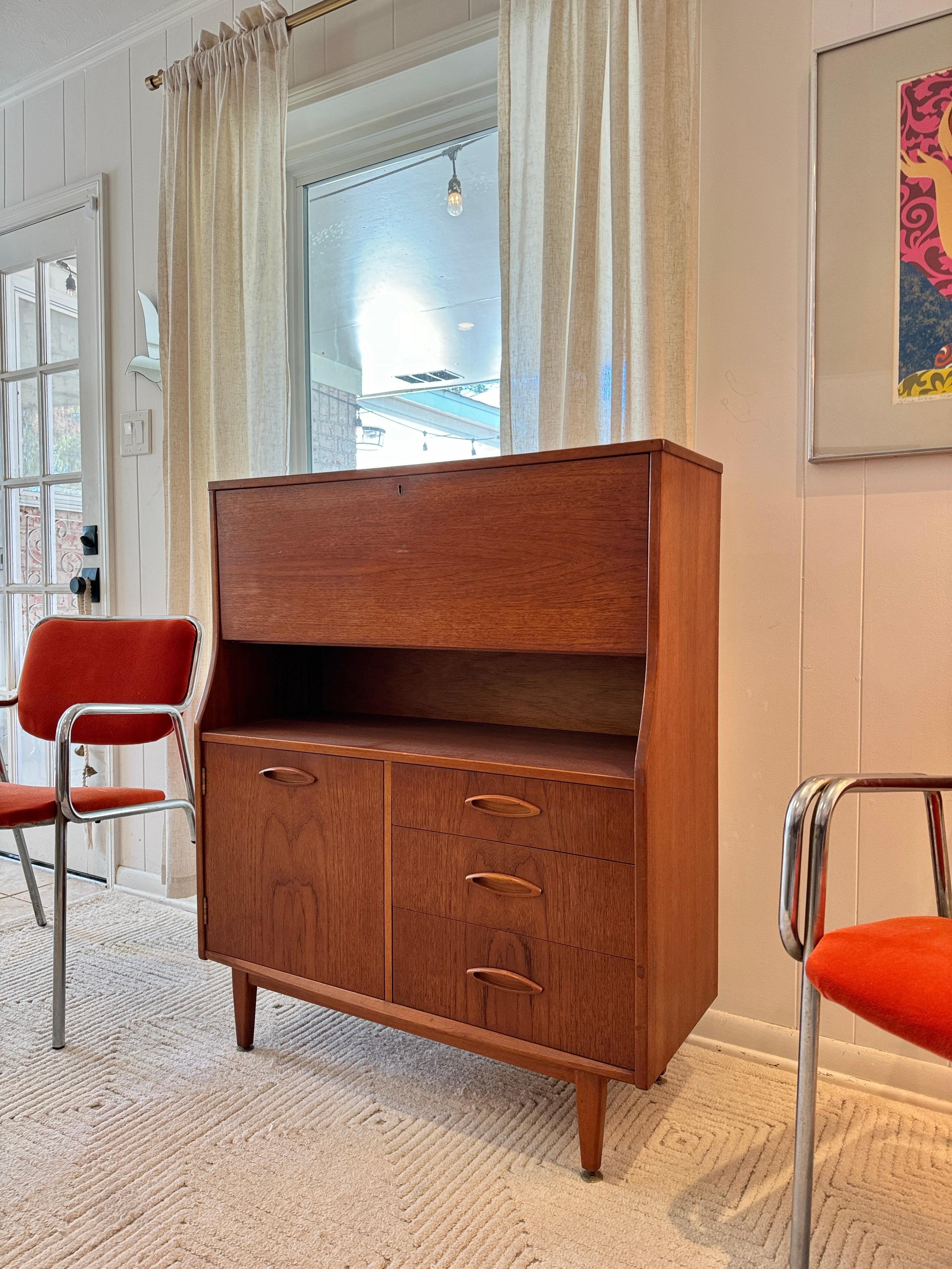 A mid century modern cabinet with a drop front desk by Jentique furniture 5