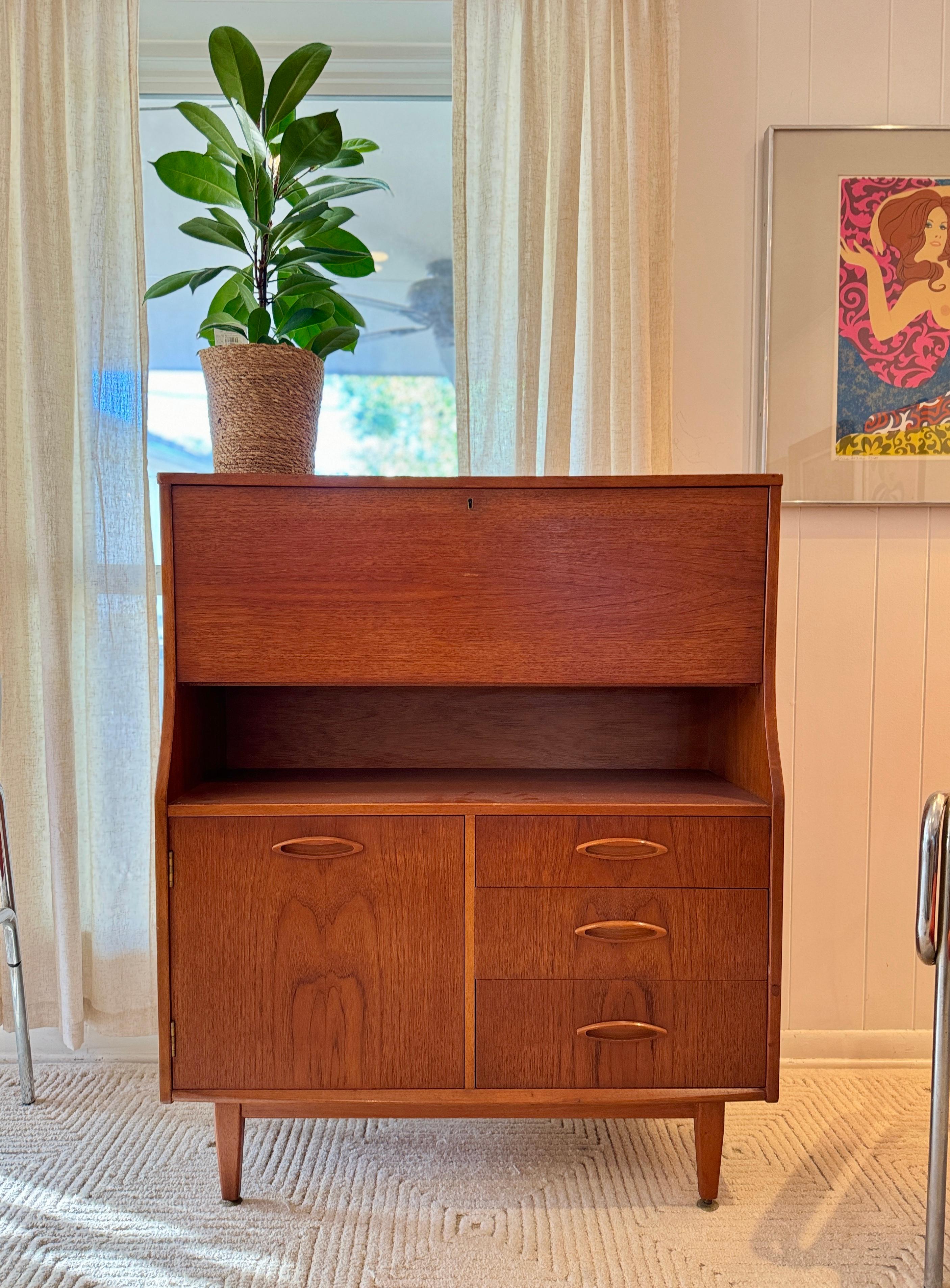 Mid-Century Modern A mid century modern cabinet with a drop front desk by Jentique furniture