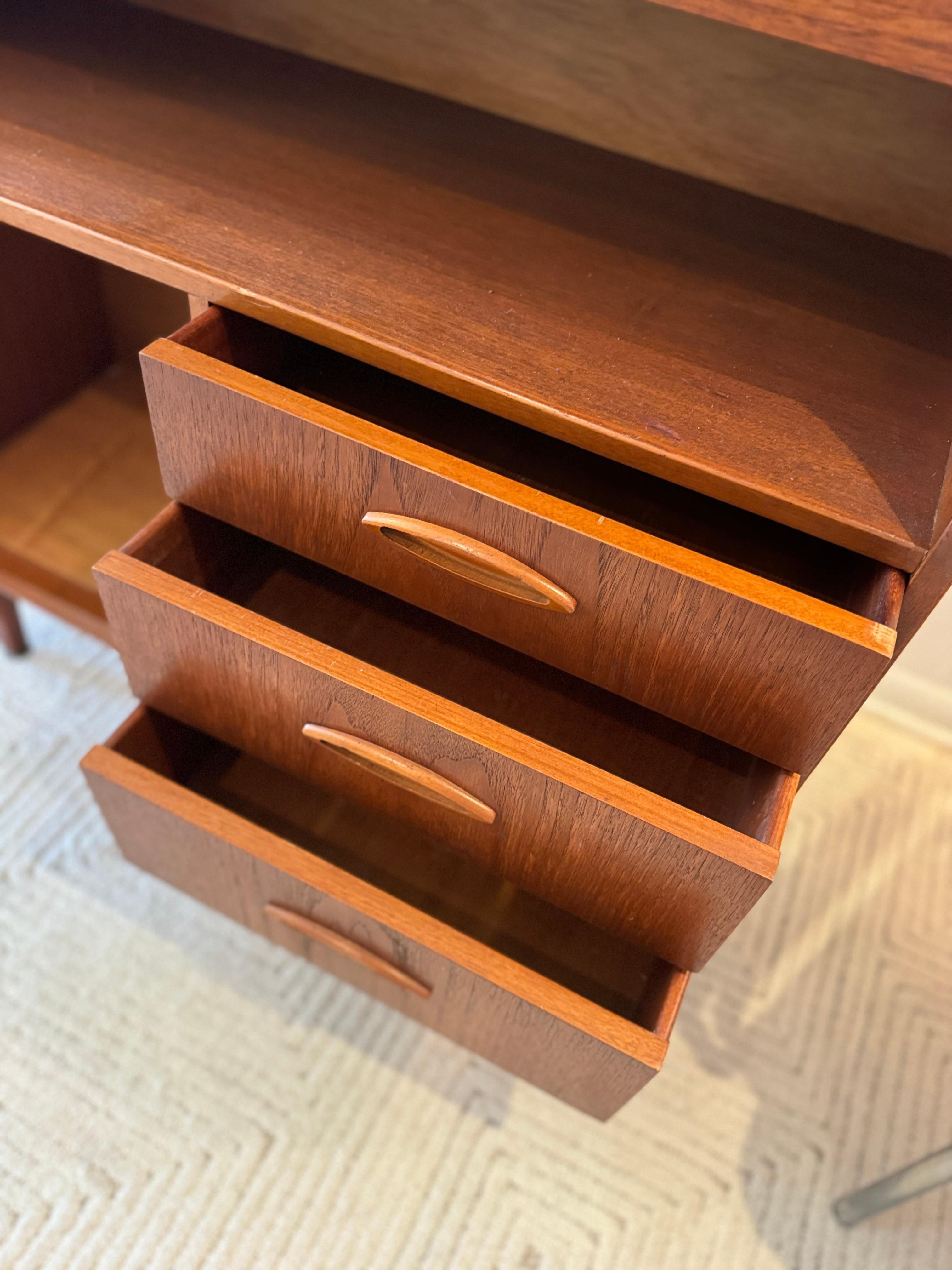 A mid century modern cabinet with a drop front desk by Jentique furniture 1