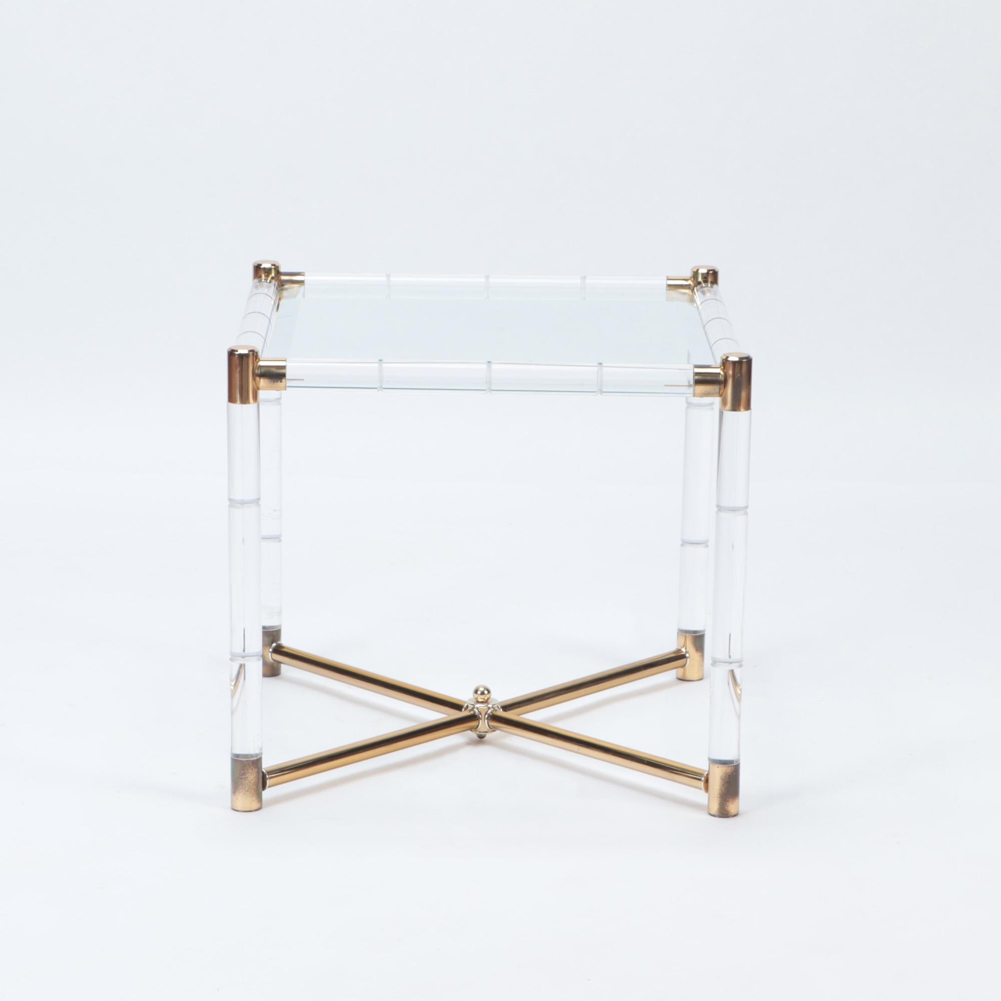 A Mid-Century Modern Charles Hollis Jones designed end table, 1950s. Lucite with brass corner bracket joints and X base.