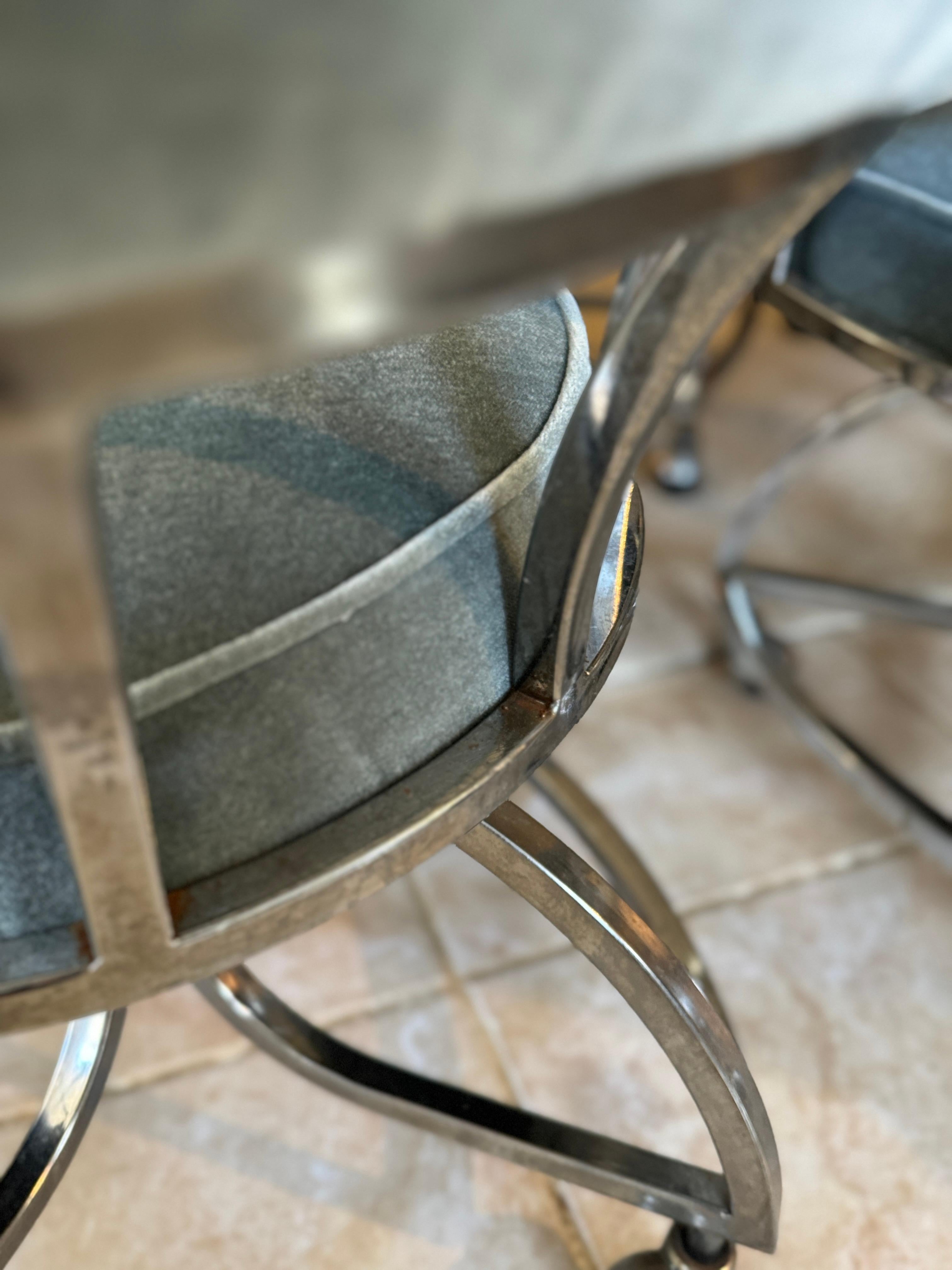 A mid century modern chrome dining set including 4 chairs and table 1970s 4