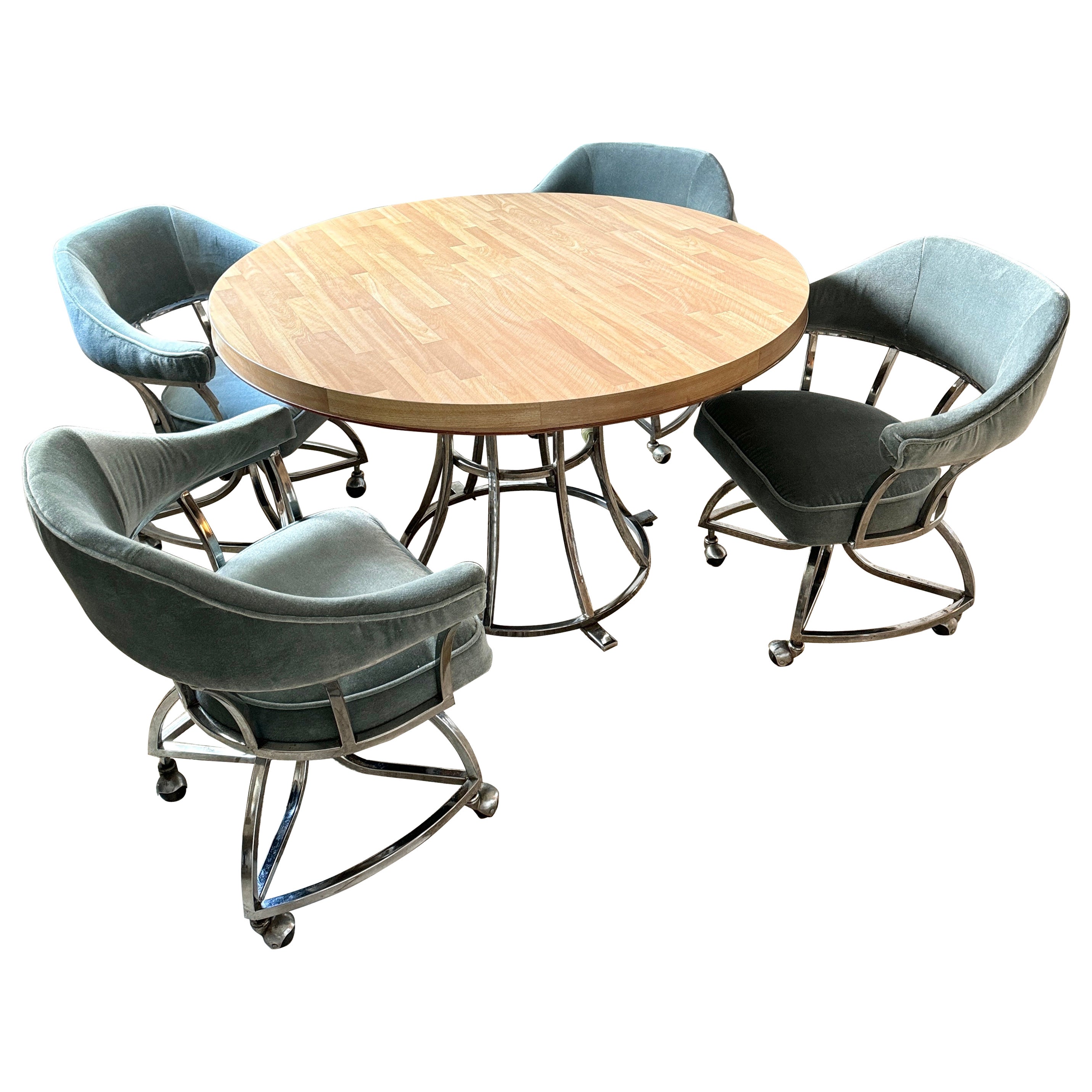 A mid century modern chrome dining set including 4 chairs and table 1970s