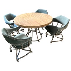 A mid century modern chrome dining set including 4 chairs and table 1970s