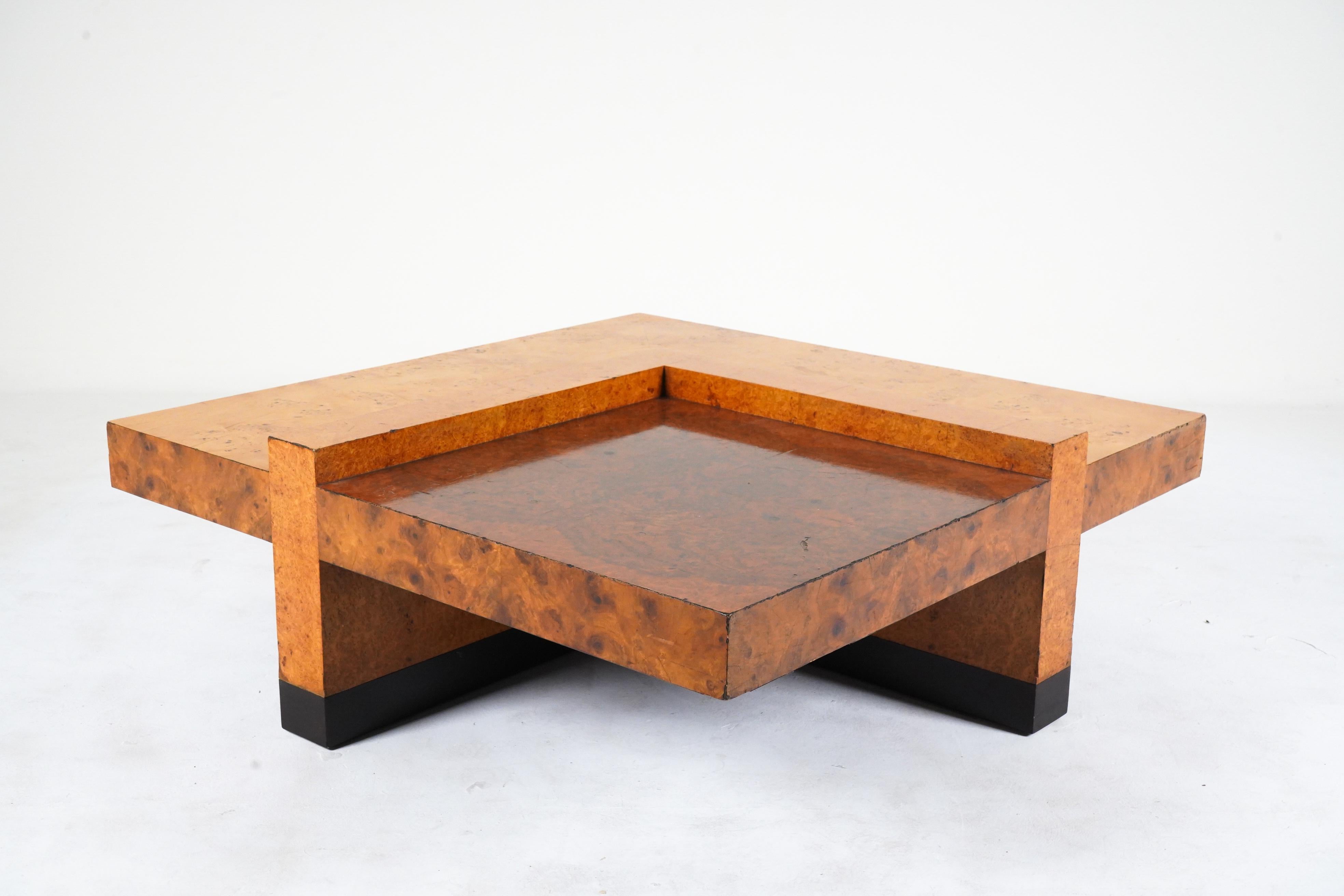 An Italian mid-century coffee table made from burlwood veneer in contrasting shades. The burl is very thick and secure and the design is rare. Condition is vintage -with expected scratches, minor chips and imperfections. There are no significant