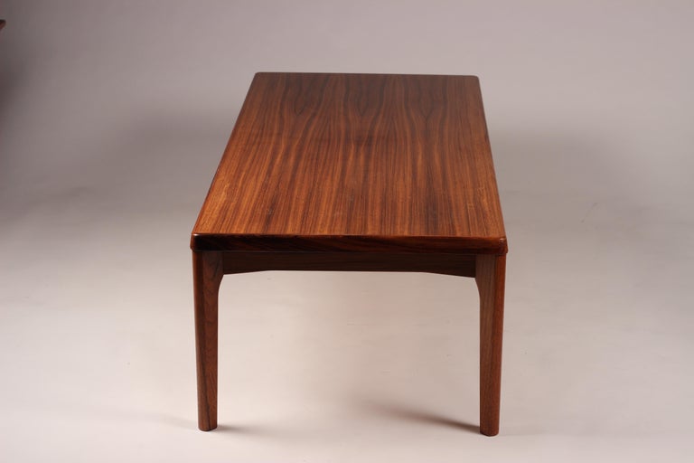 A Scandinavian Modern coffee table of good proportions, with beautiful teak grain timber. We have re waxed and revived this piece professionally. Please look at the simple and understated details around the edges and legs of the table. The Legs