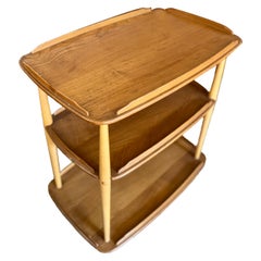 A mid century modern elm and beech bar cart by Ercol & designed by Lucian Ercola