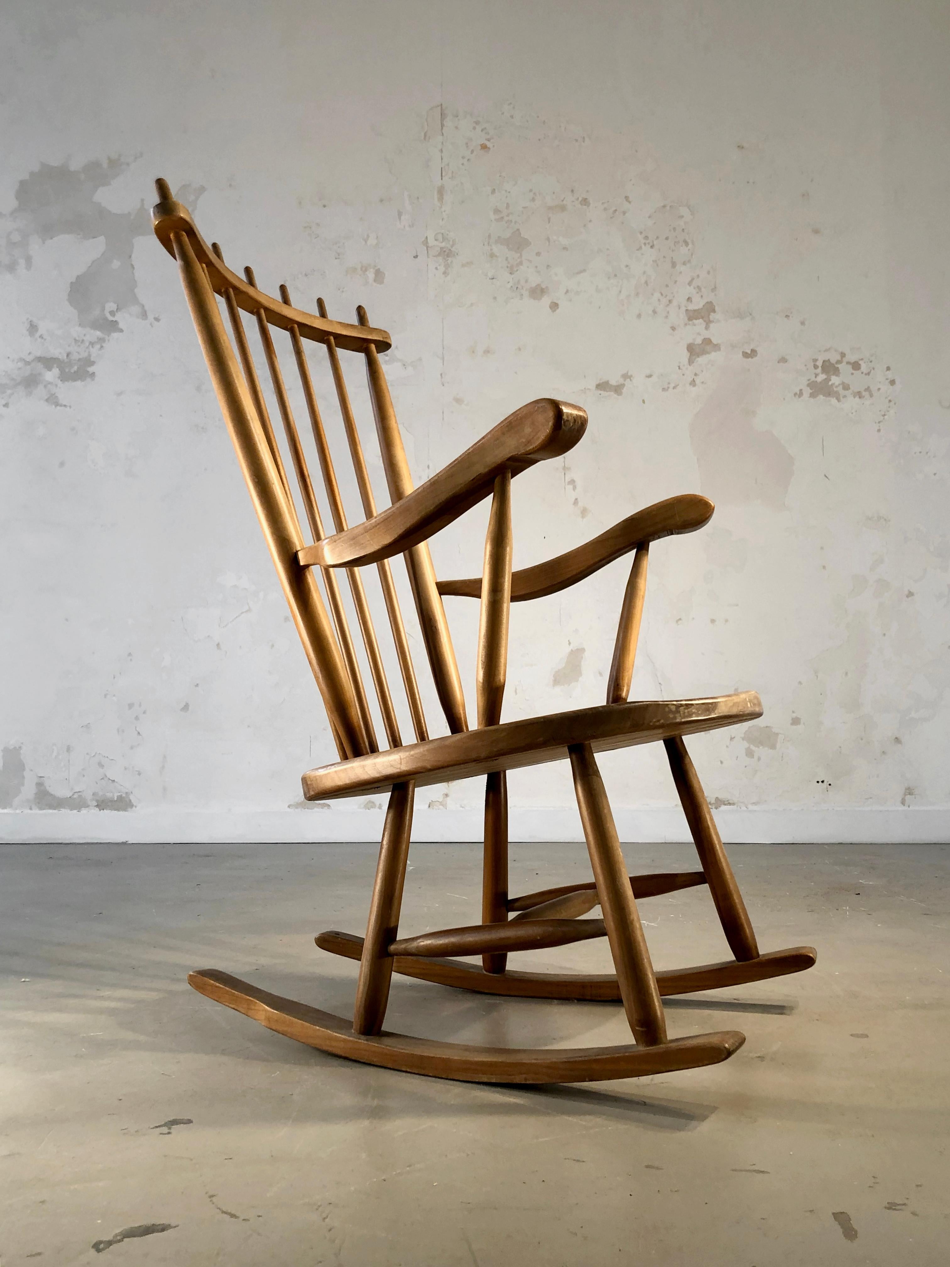 An elegant rocking chair with generous sensual lines, Modernist, Mid-Century-Modern, Free-Form, in carved solid light wood, in the taste of Georges Nakashima, by De Ster Gelderland, Holland 1950.