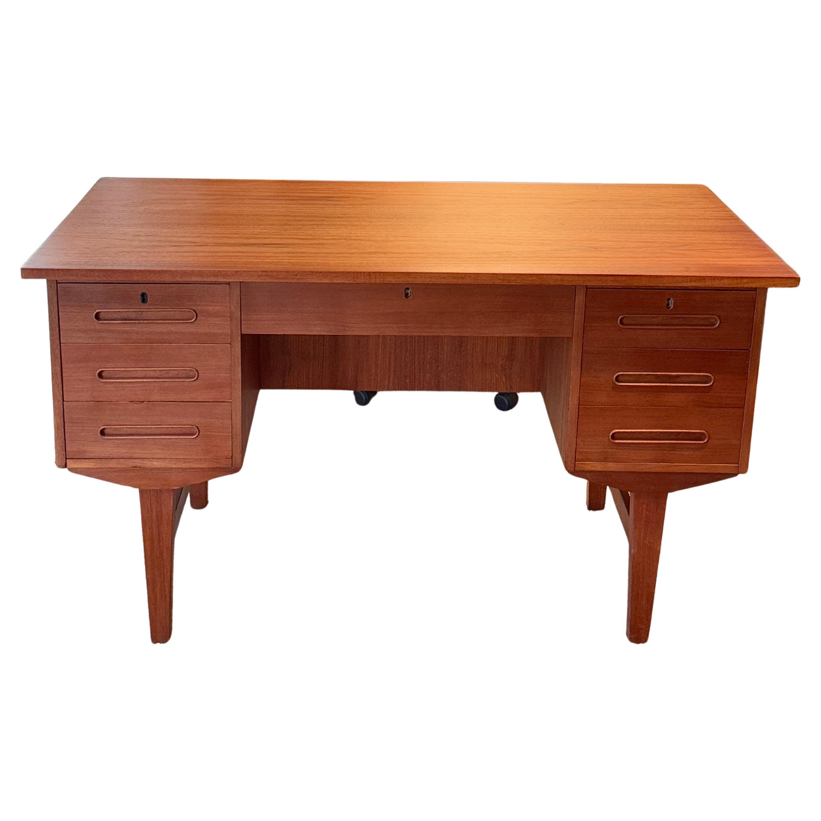 A mid century modern front facing desk made in Denmark, circa 1960s