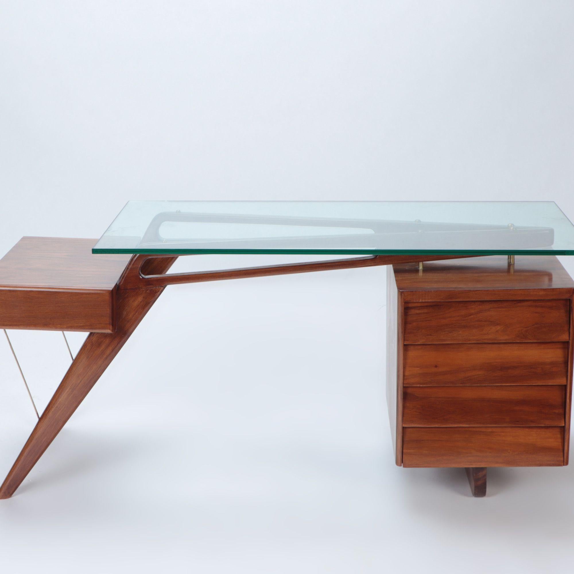 A Mid-Century Modern Italian four drawers walnut and glass top desk in the manner of V.Dassi, circa 1960. Beautiful Italian Design.