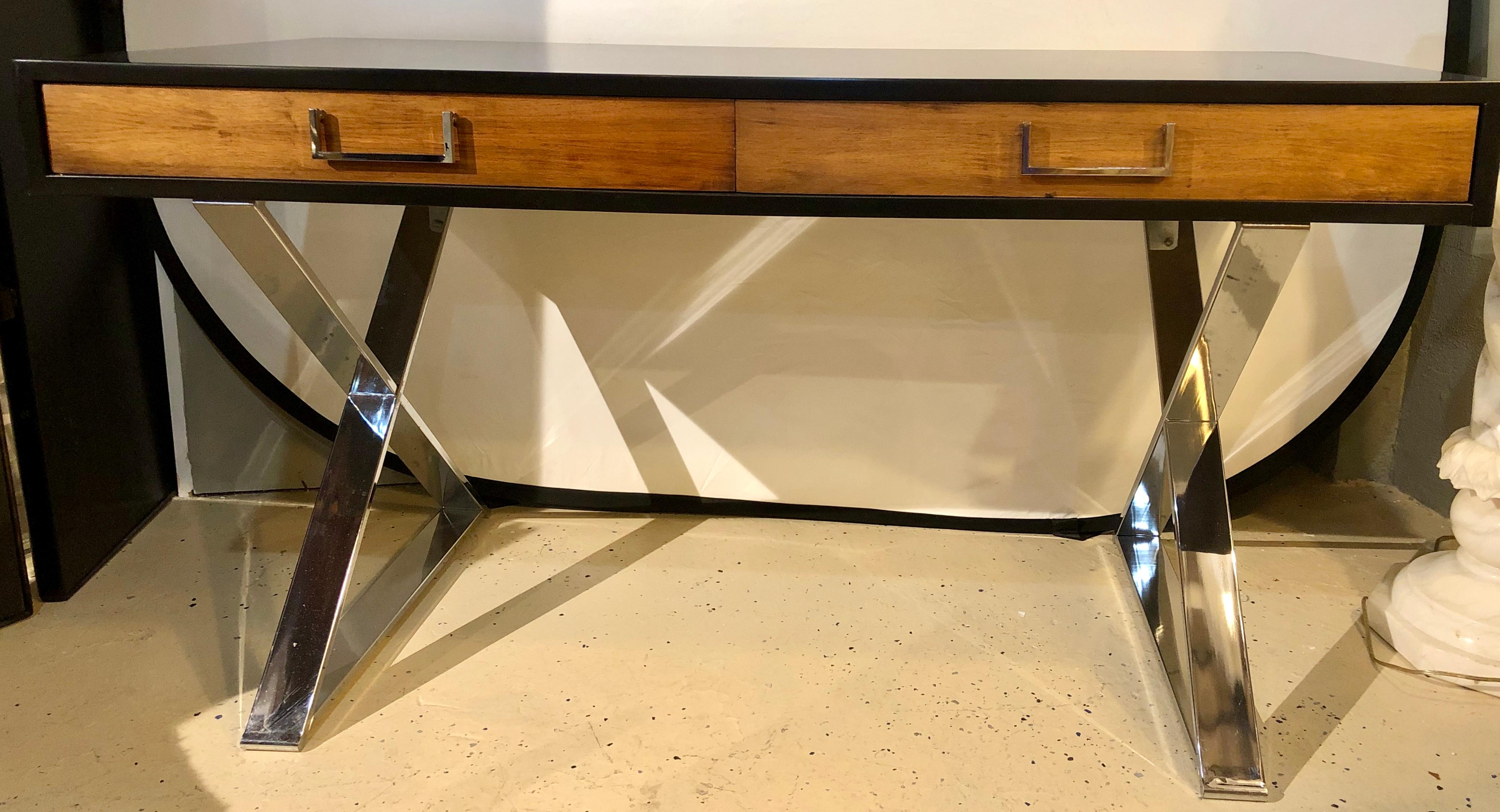 A Mid-Century Modern vanity desk. This fully refinished desk or vanity having a walnut drawer front with an ebony frame on chrome X based support.