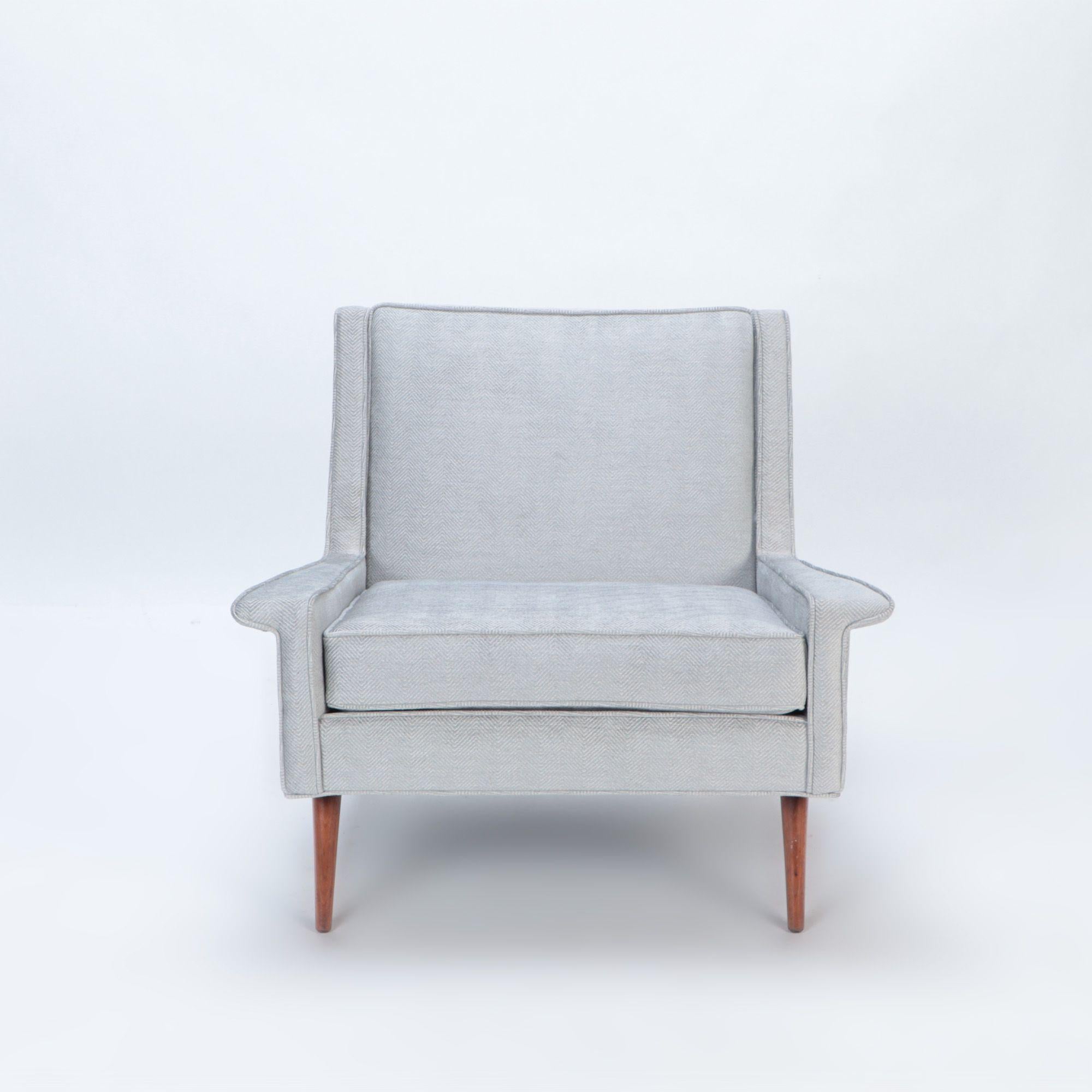 A Mid Century Modern newly upholstered lounge chair, in the style of Paul McCobb, circa 1950.