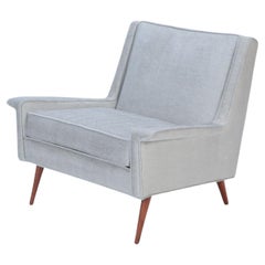 A Mid Century Modern newly upholstered lounge chair, circa 1950.