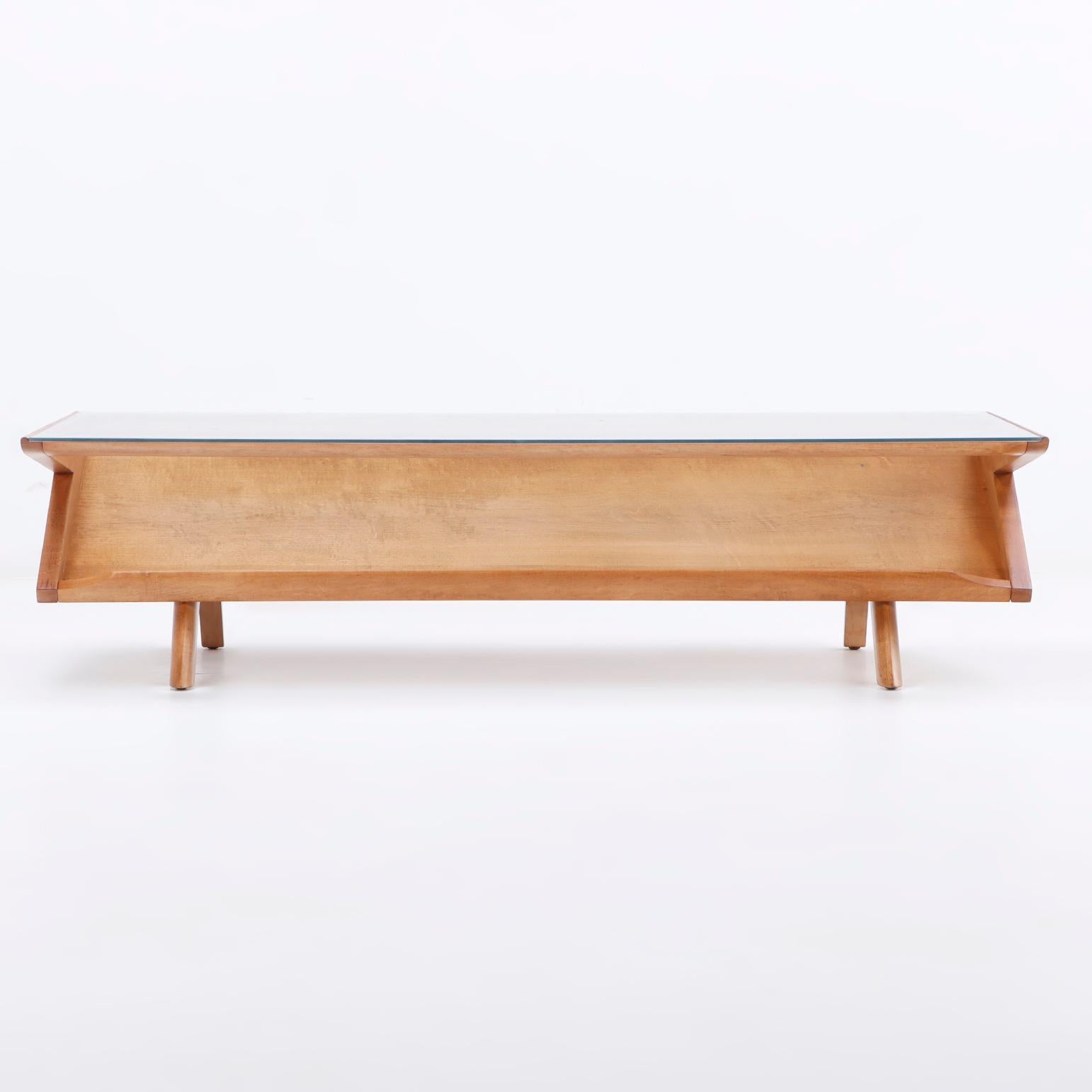 A mid century modern Paul Laszlo for Brown Saltman blonde mahogany cantilevered coffee table.  A Classic design by Paul Laszlo for the prominent California design company Brown Saltman.