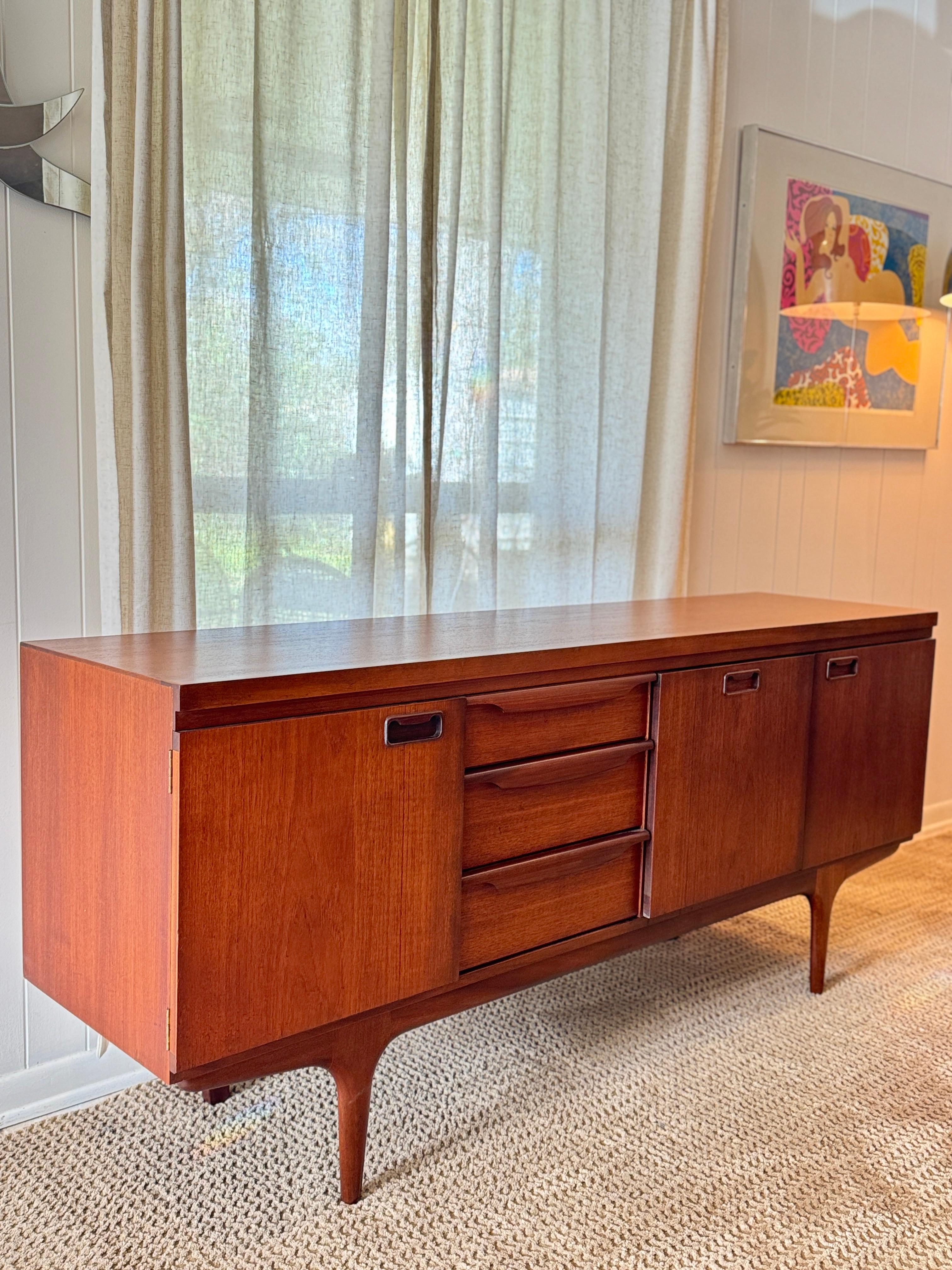 A mid century modern sideboard by British furniture maker Greaves & Thomas 1