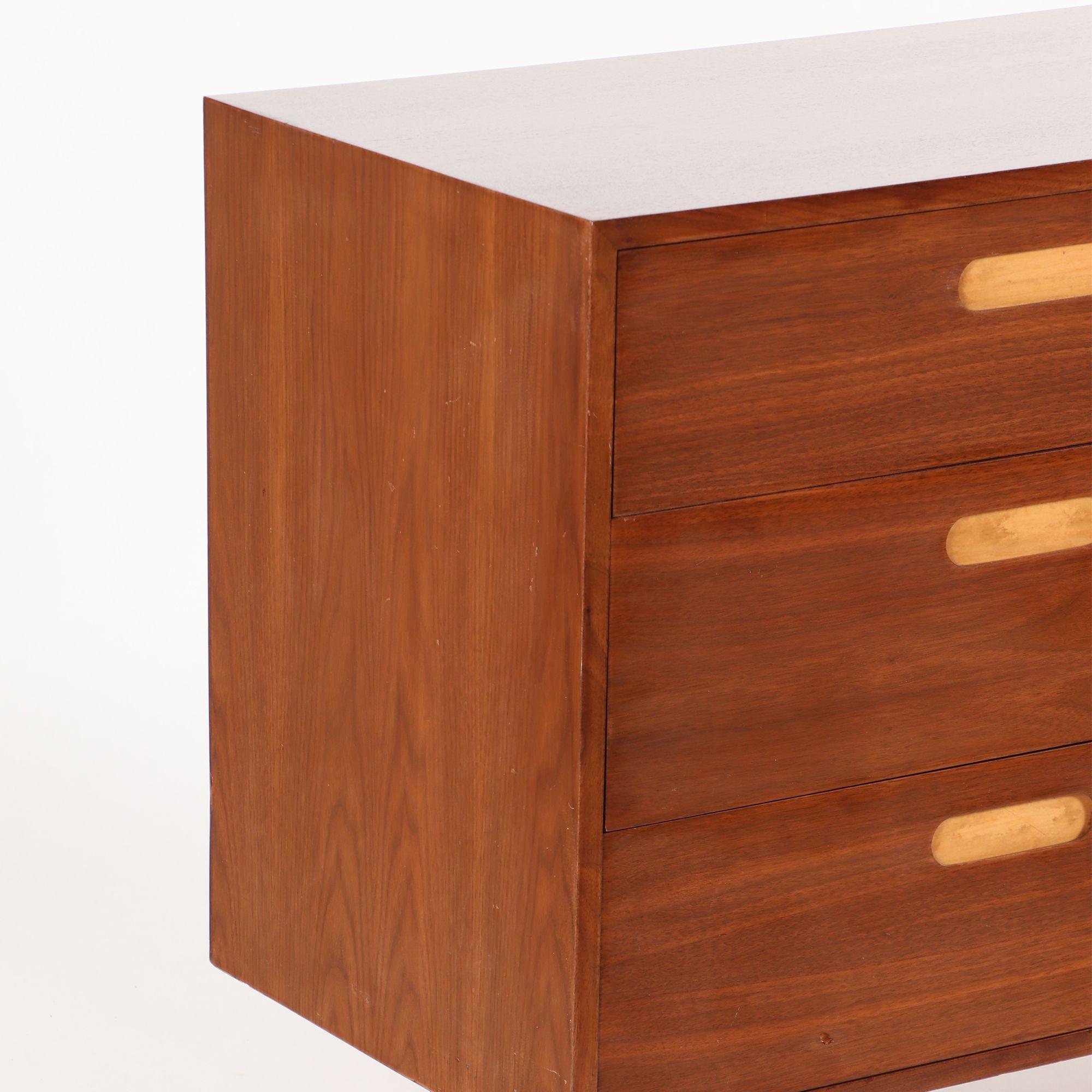 A Mid-Century Modern six drawers walnut dresser with recessed drawer pulls, circa 1960.