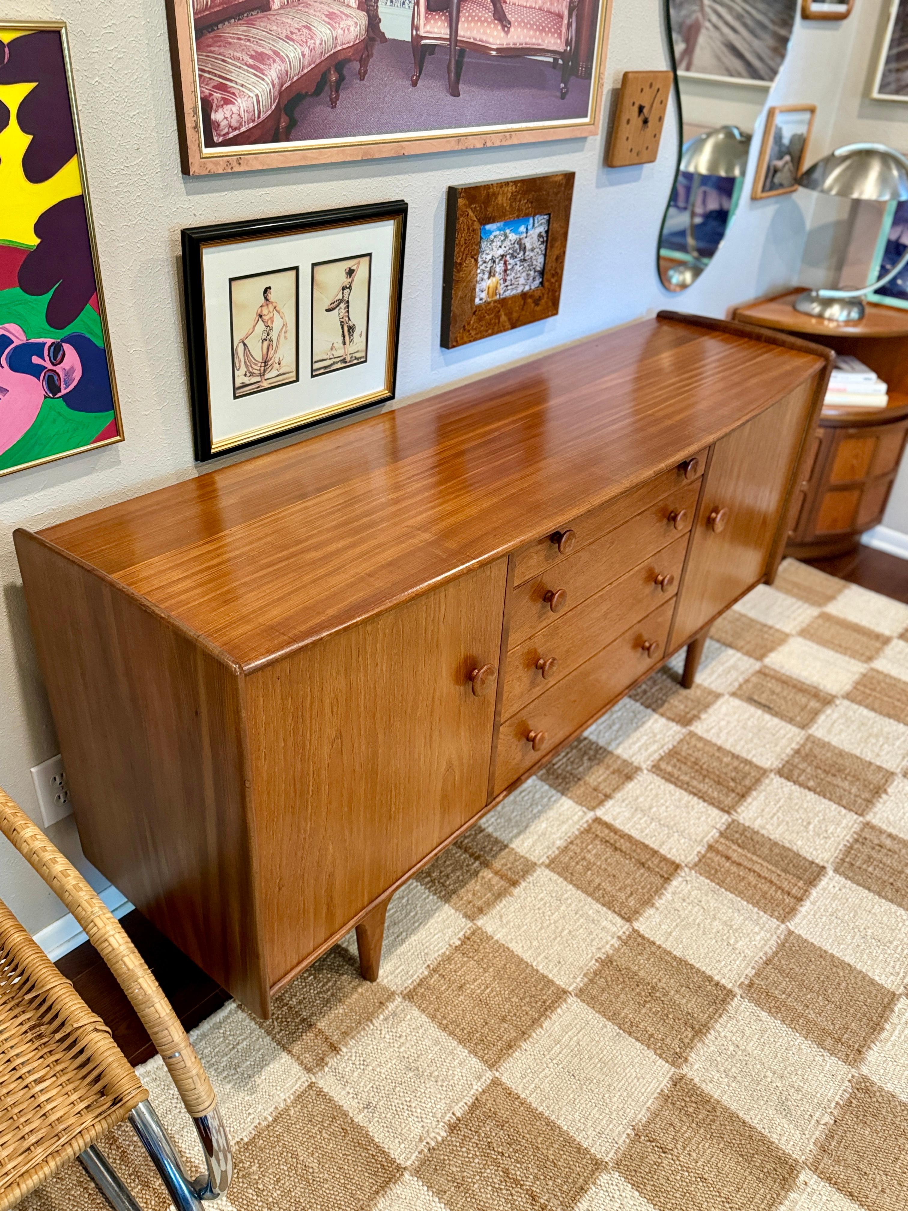 Mid-Century Modern A mid century modern solid teak credenza designed by John Hebert for Younger For Sale