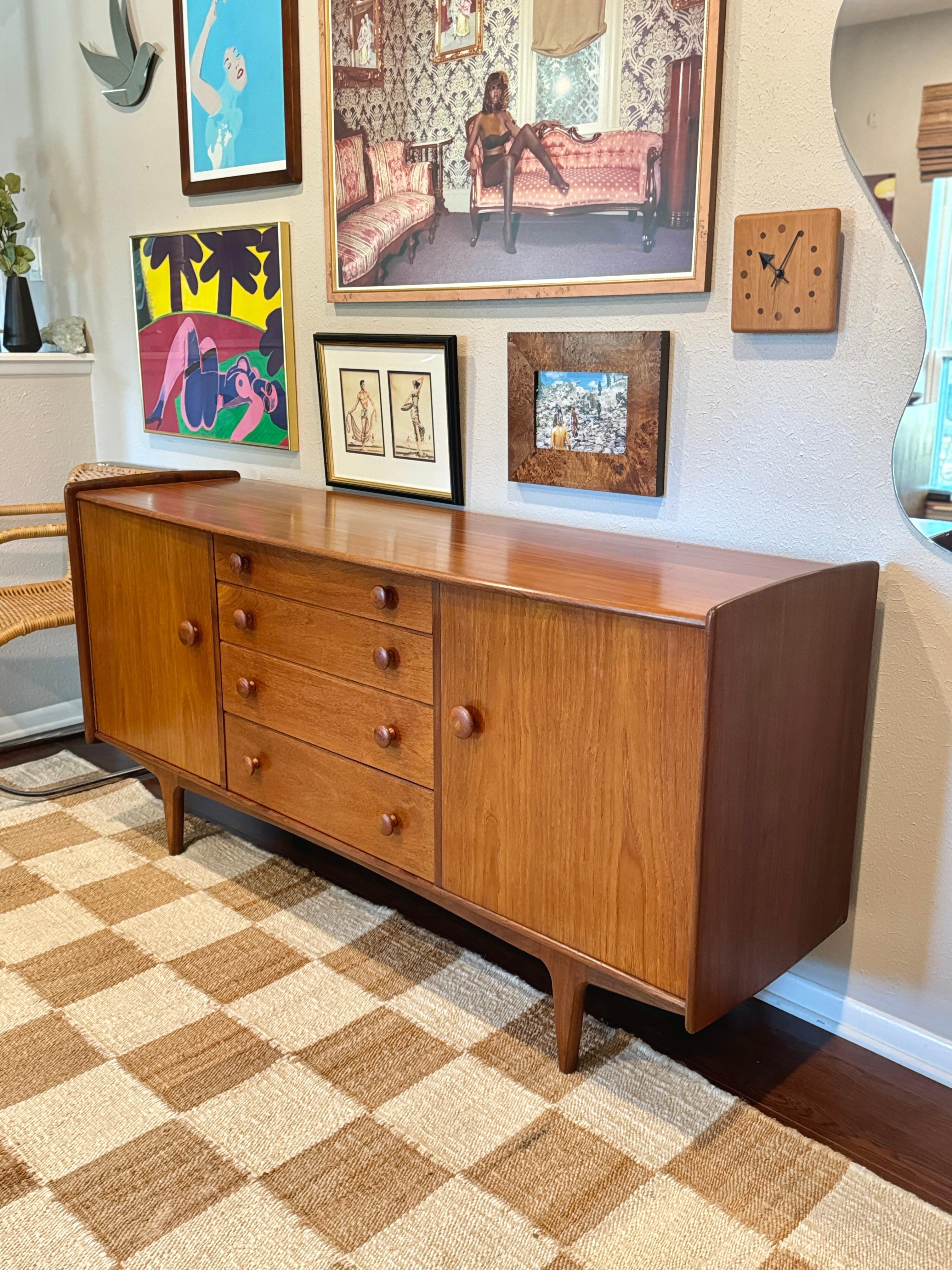European A mid century modern solid teak credenza designed by John Hebert for Younger For Sale