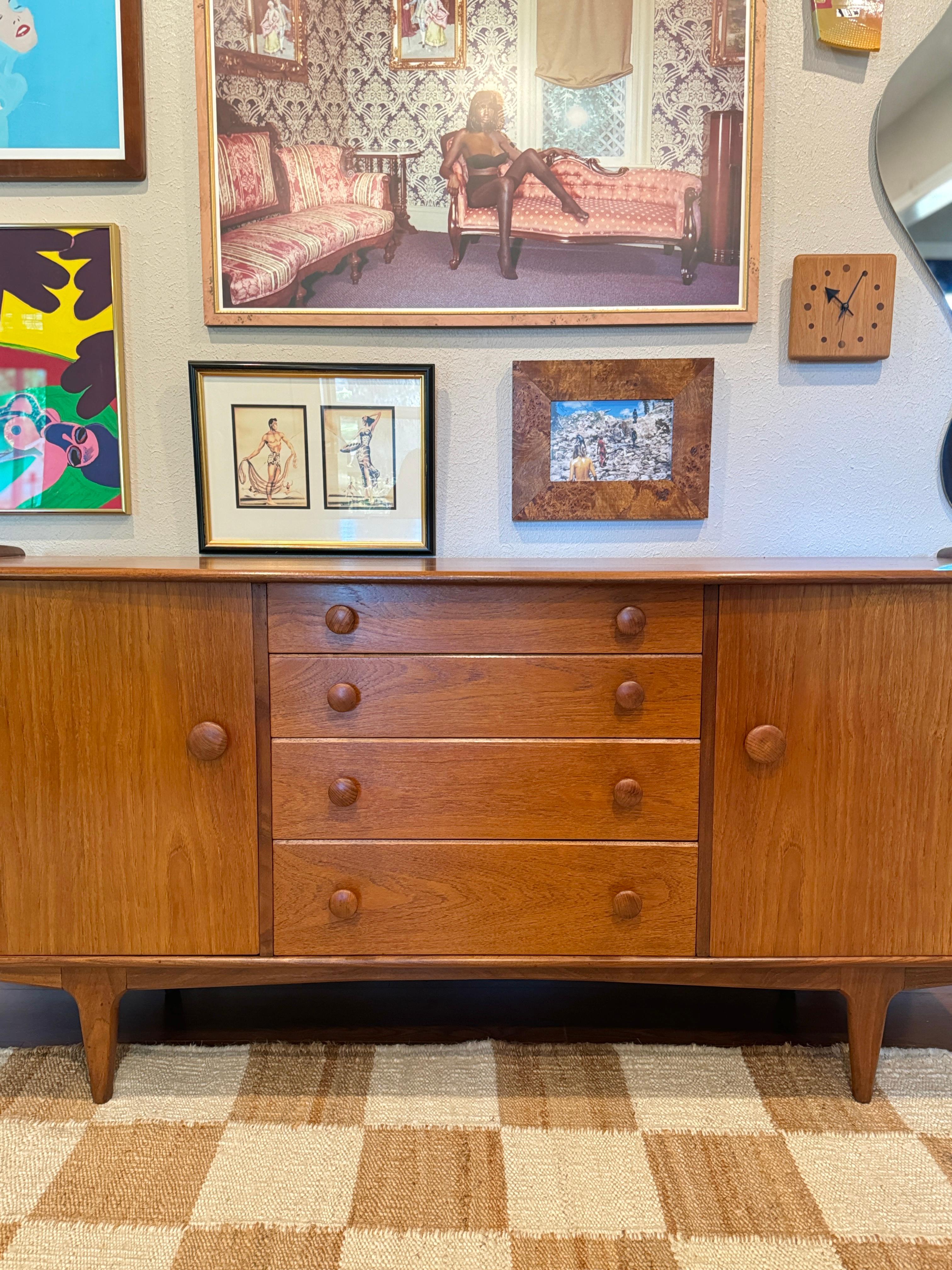 A mid century modern solid teak credenza designed by John Hebert for Younger In Good Condition For Sale In Houston, TX