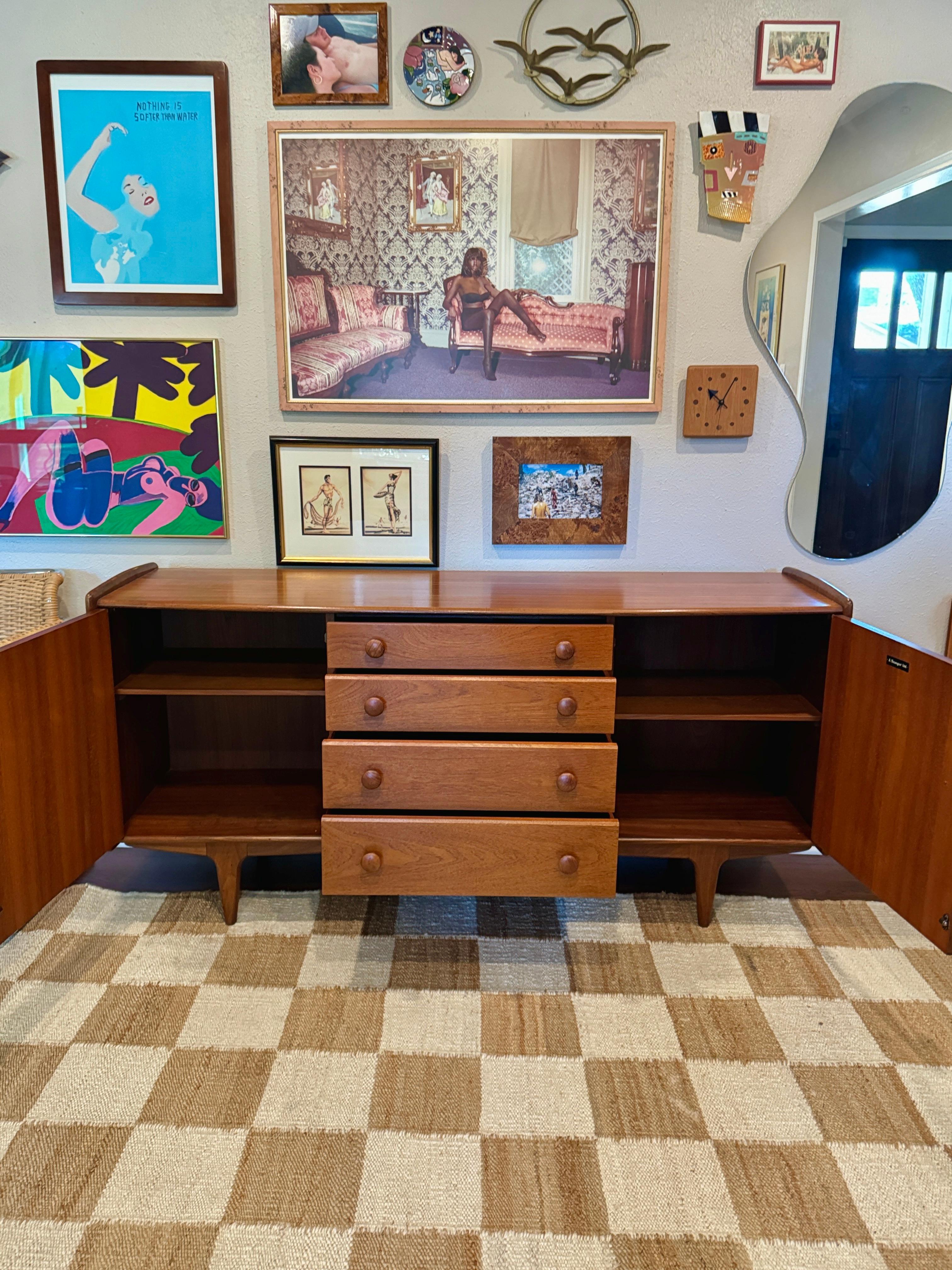 Teak A mid century modern solid teak credenza designed by John Hebert for Younger For Sale