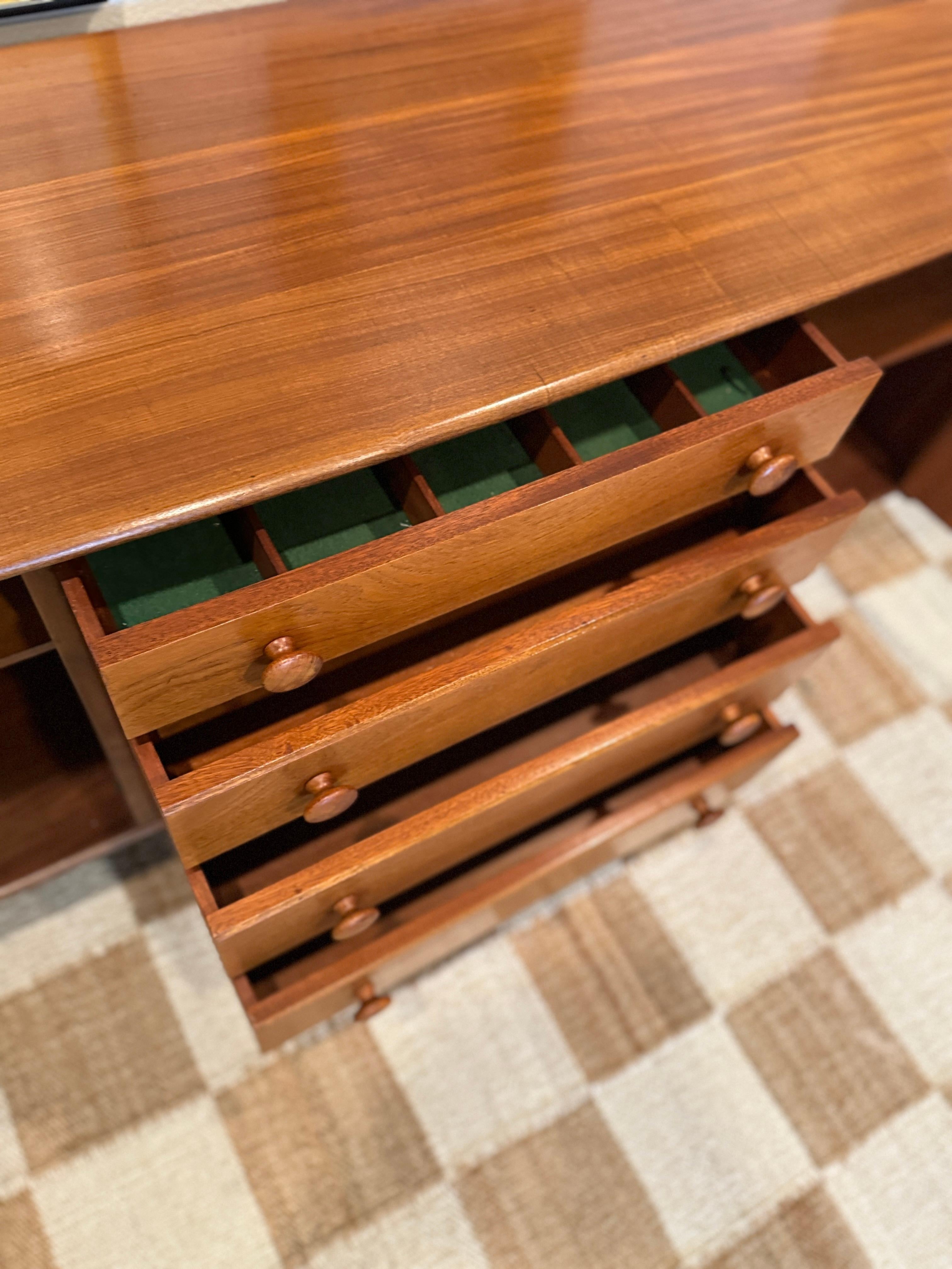 A mid century modern solid teak credenza designed by John Hebert for Younger For Sale 1