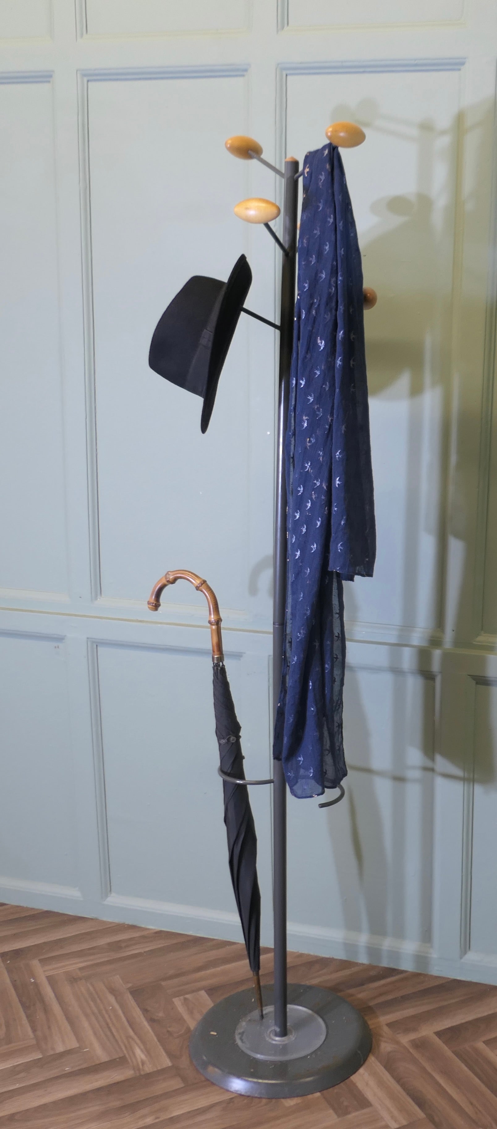 

A Mid Century Modern Sputnik Hat and Coat Stand

This is a very stylish Hat Coat & Umbrella Hall Stand, it has 4 upward curving pegs at the top and an S shaped umbrella stand with the drip tray set in a sturdy round base
The Hall Stand is in Good